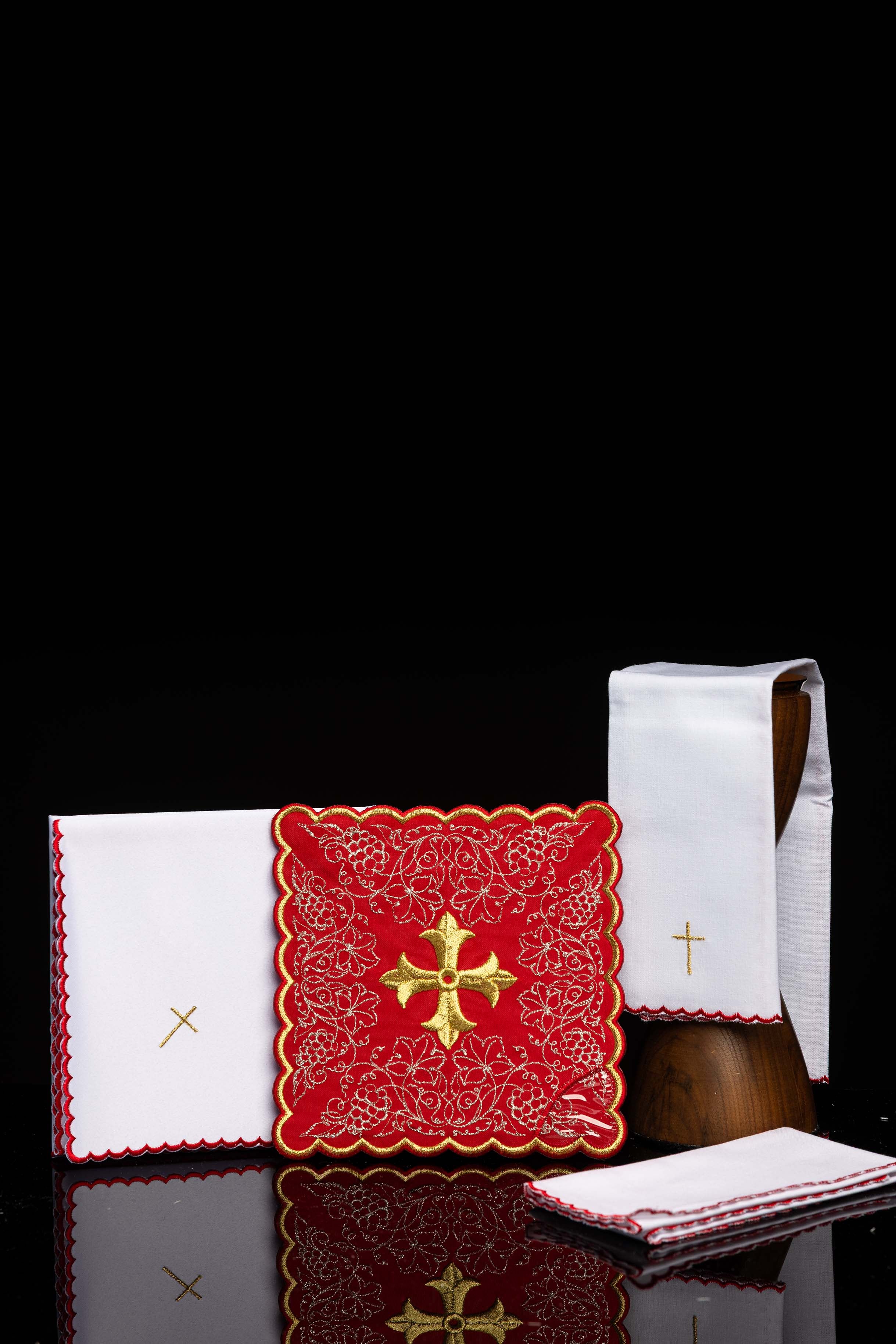 Red embroidered chalice linens set with a cross motif