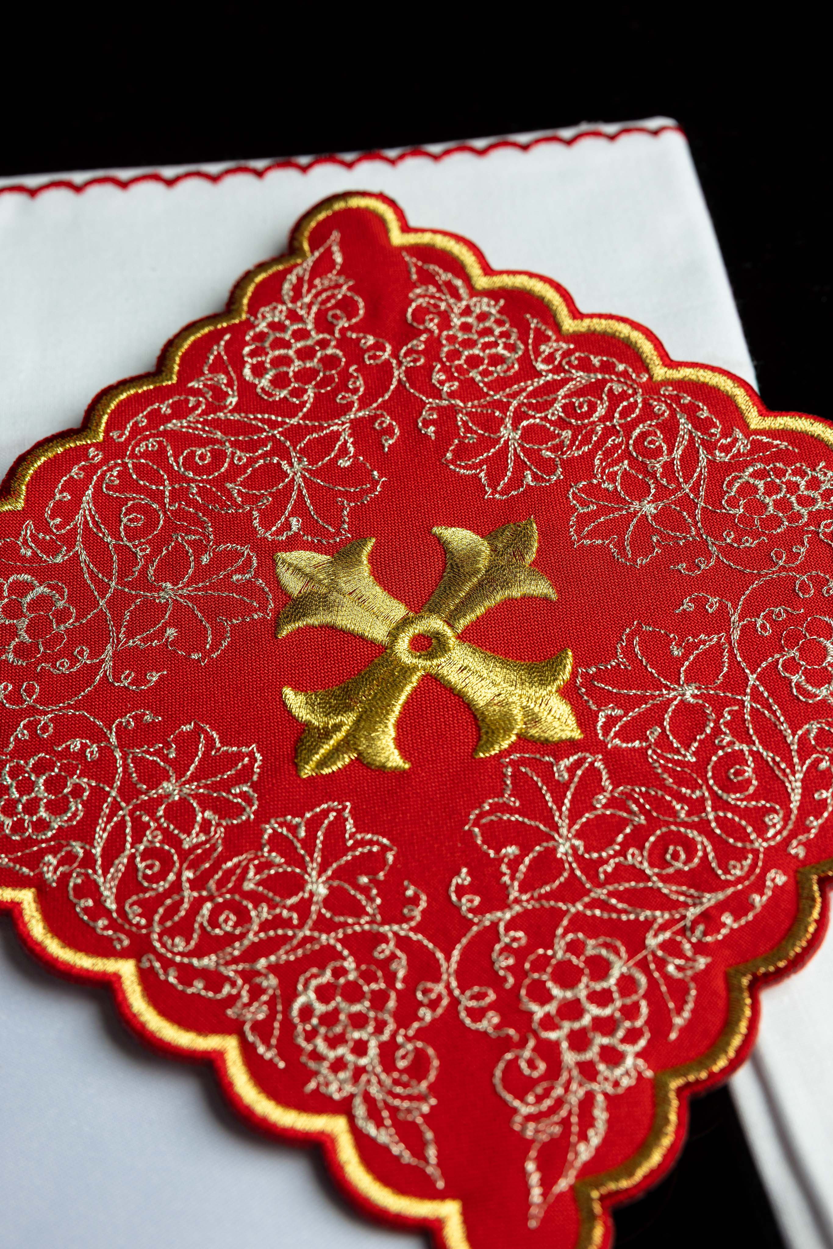 Red embroidered chalice linens set with a cross motif