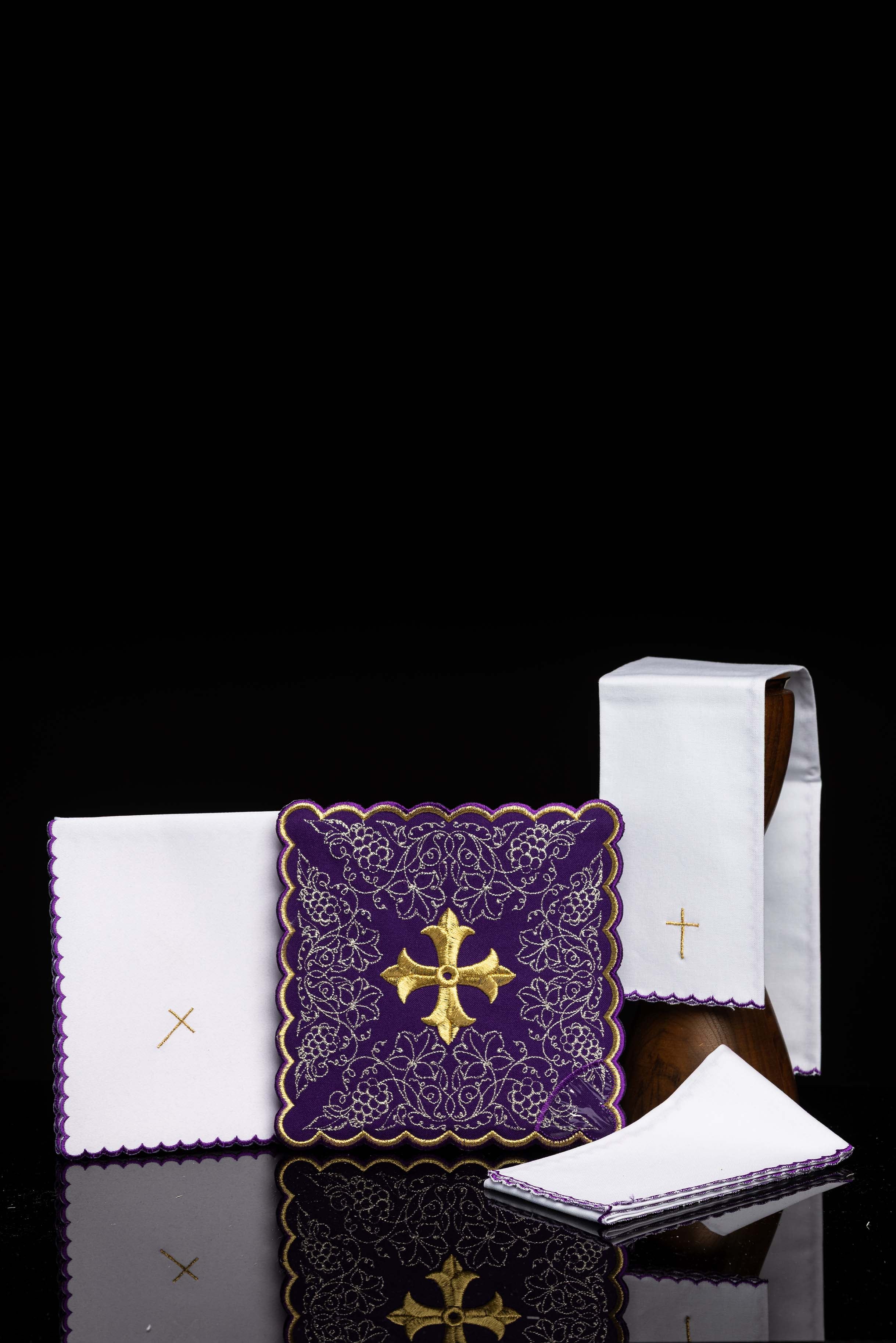 Embroidered chalice linens set with a purple cross motif