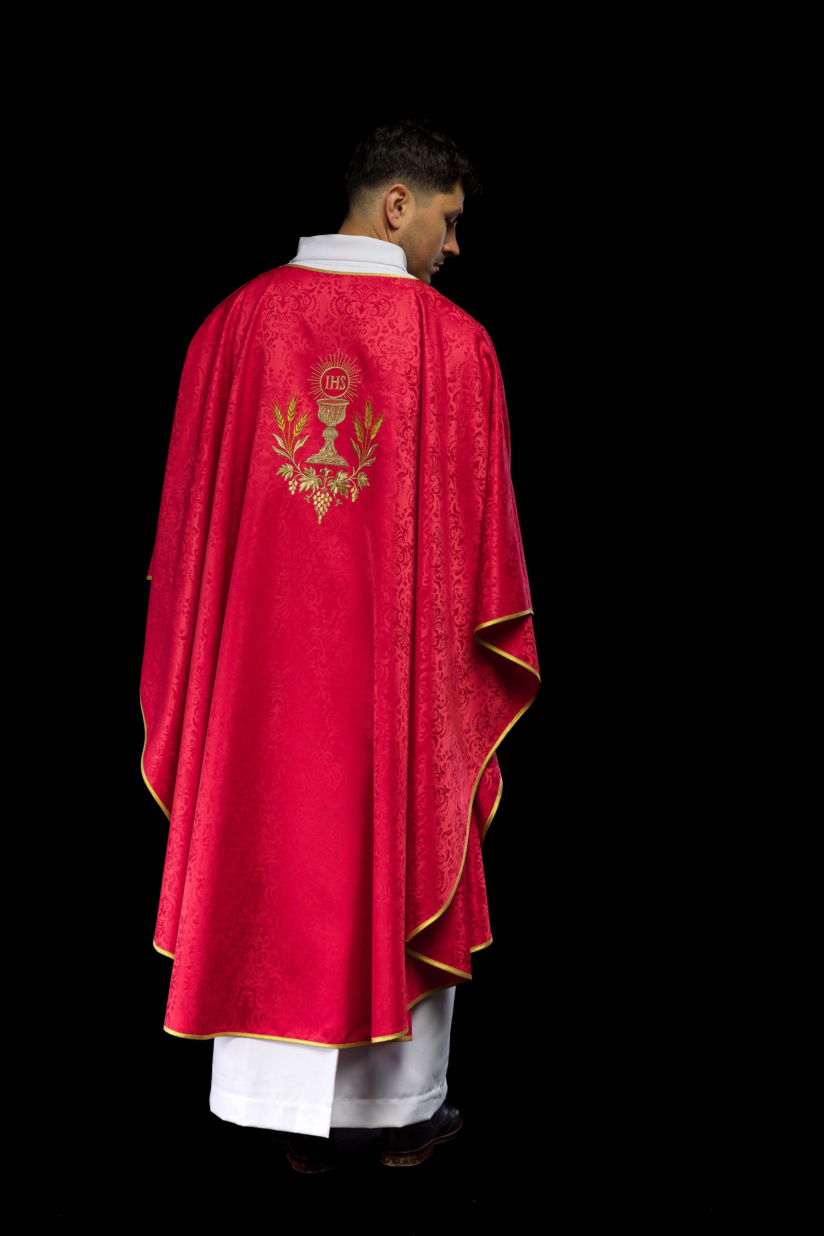 Red liturgical chasuble with embroidered chalice and host on jacquard fabric