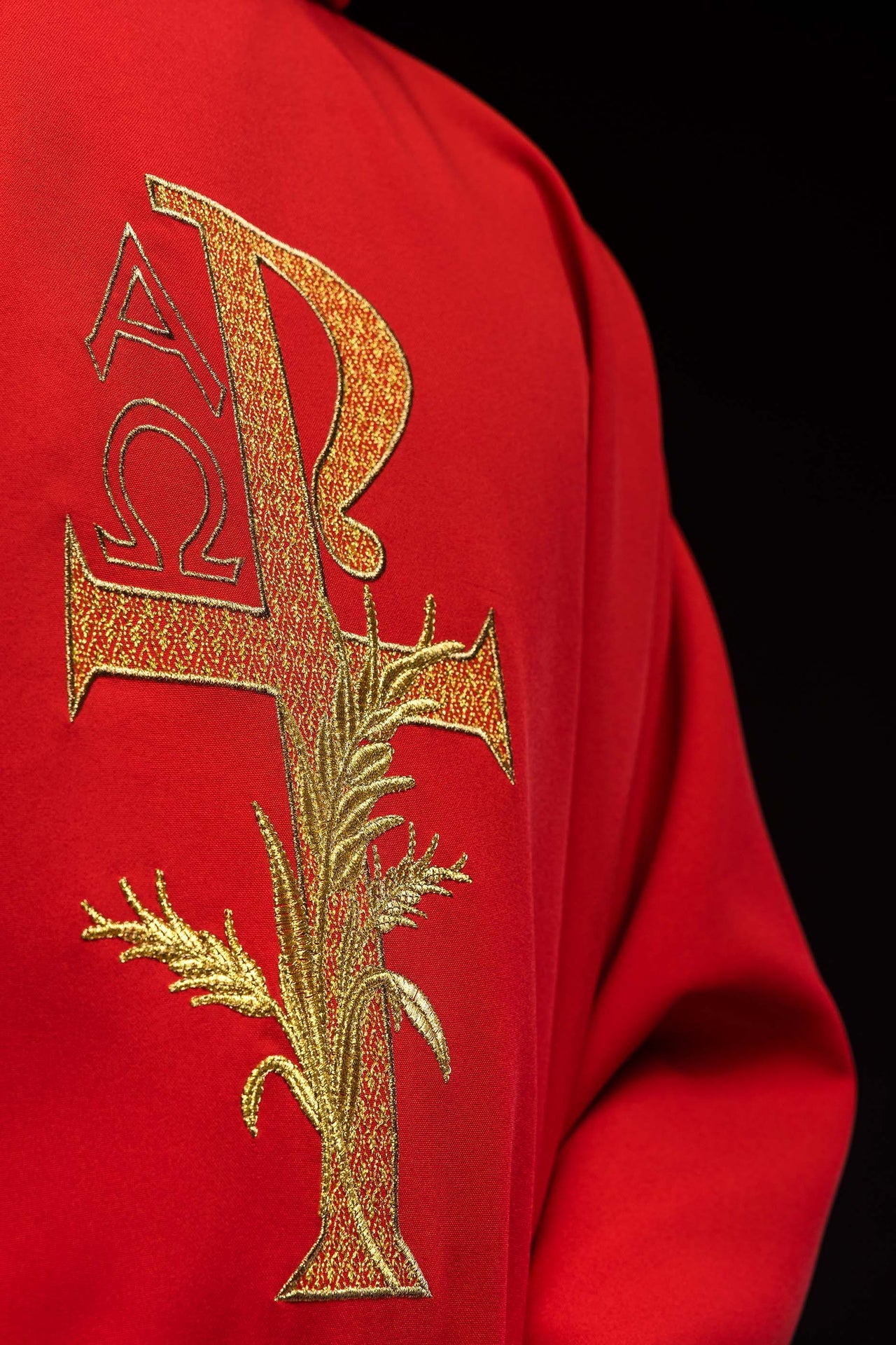 Red embroidered chasuble with Alpha and Omega symbol and wide collar