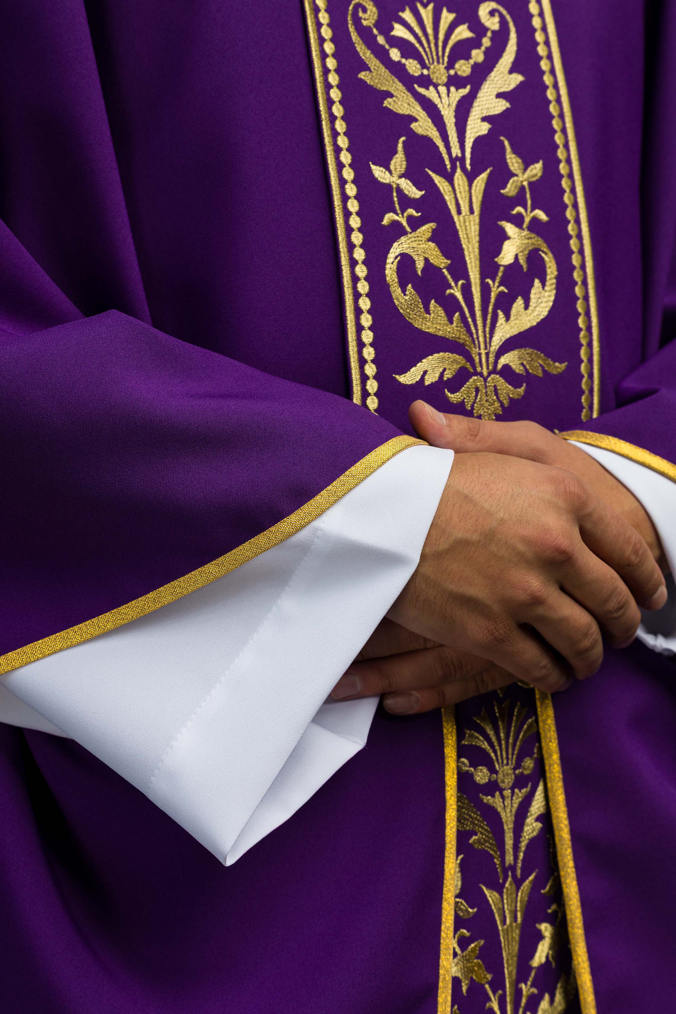 Purple liturgical chasuble decorated with a gold embroidered belt