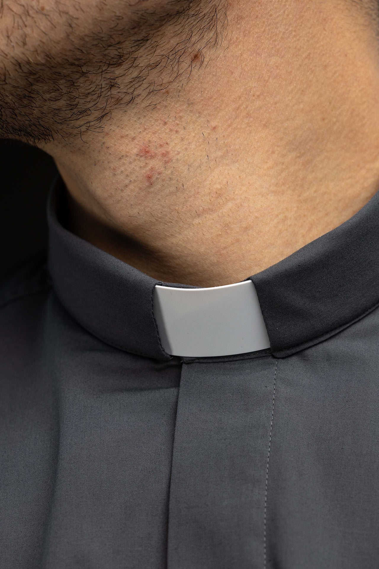 Dark grey long-sleeved clerical shirt with clerical collar