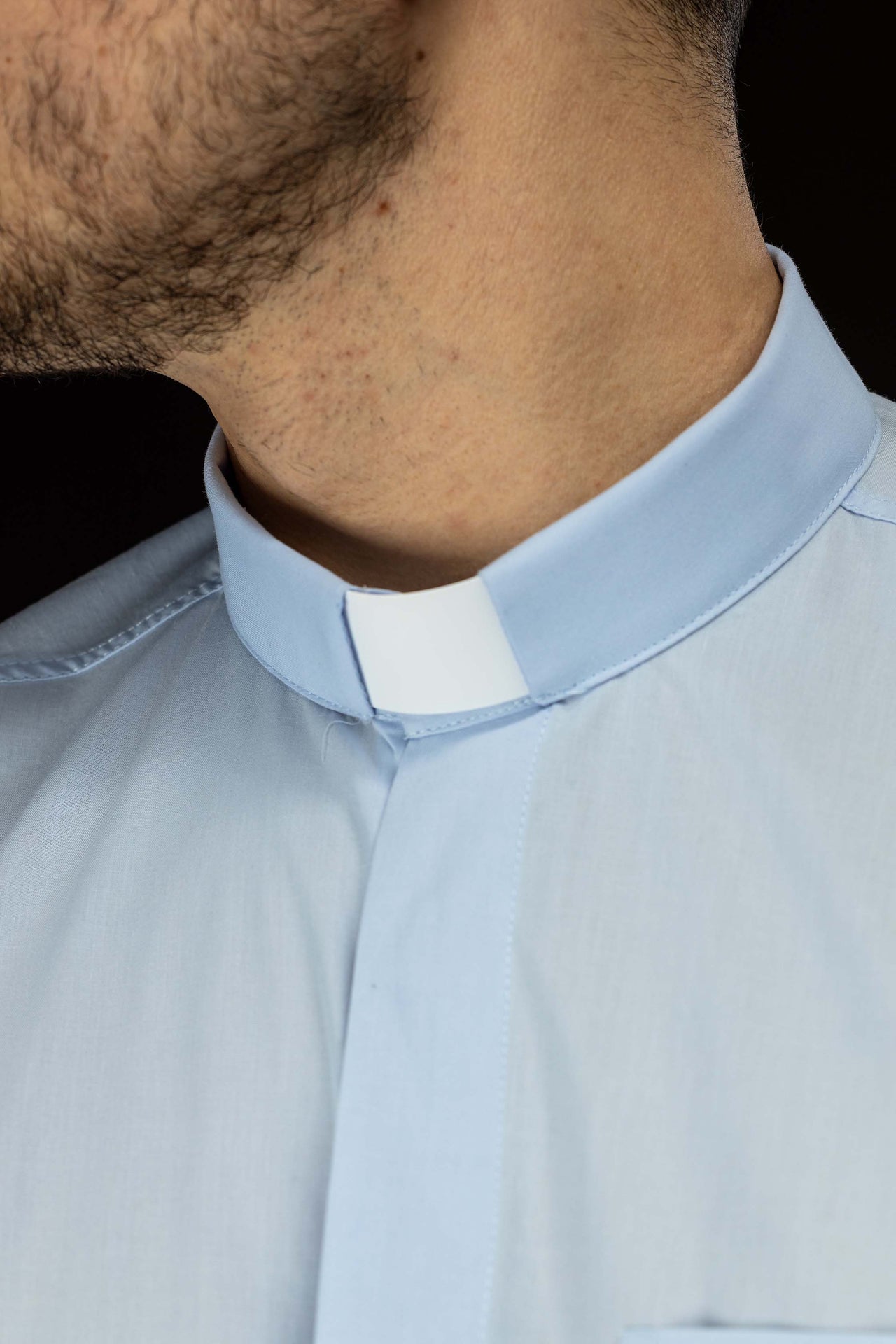 Blue long-sleeved clerical shirt with clerical collar