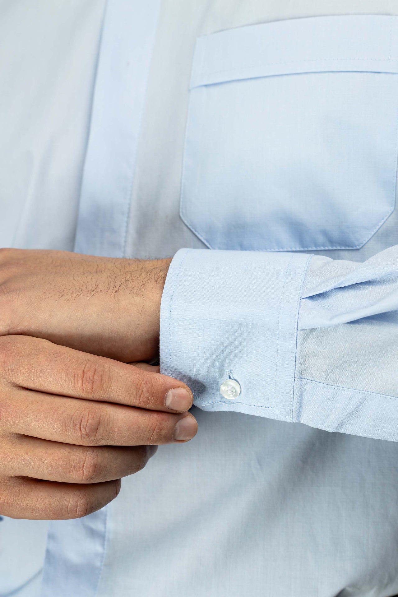 Blue long-sleeved clerical shirt with clerical collar
