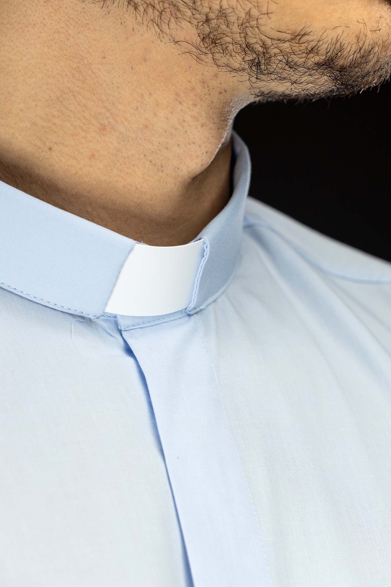 Blue long-sleeved clerical shirt with clerical collar