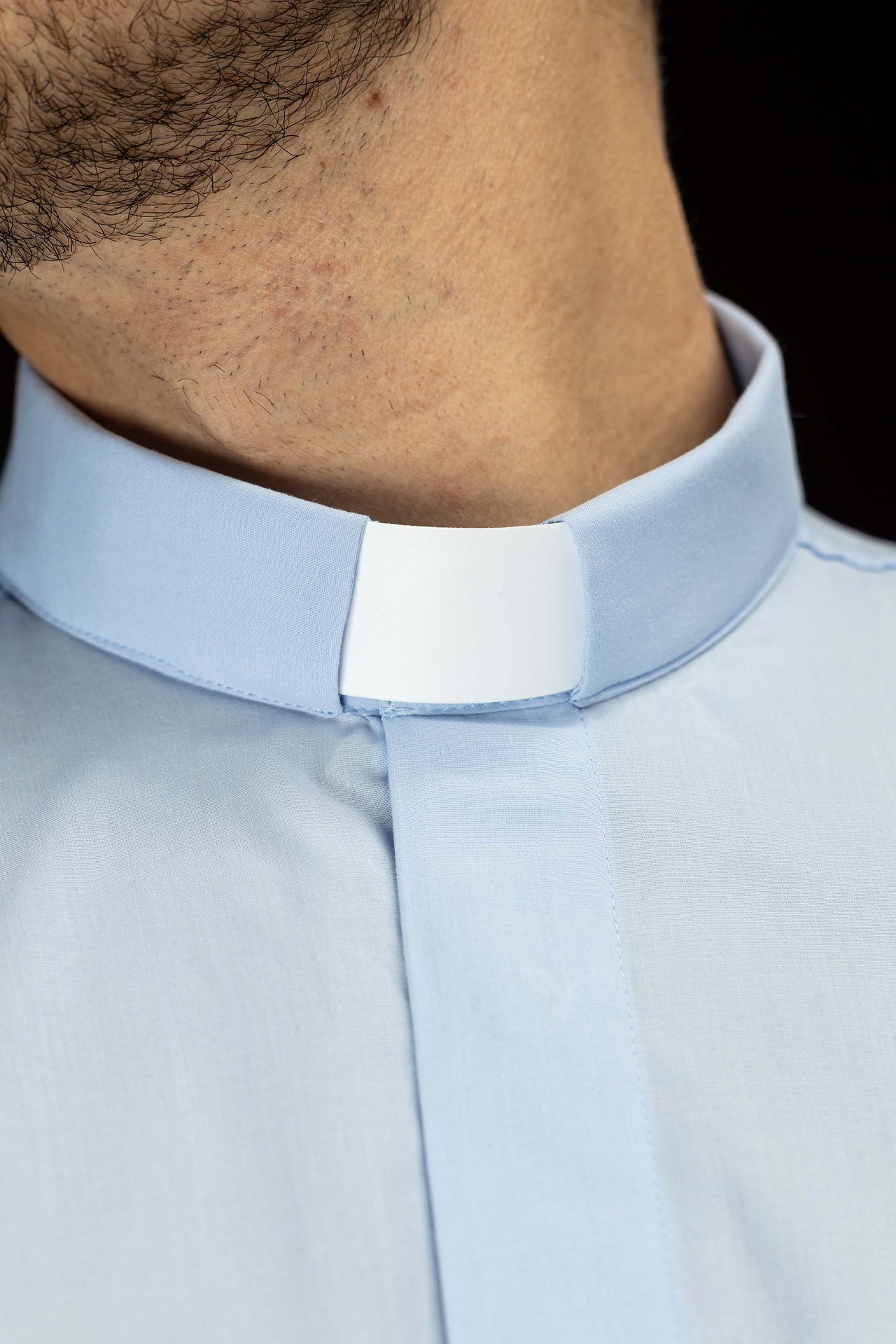 Blue short-sleeved clerical shirt with clerical collar
