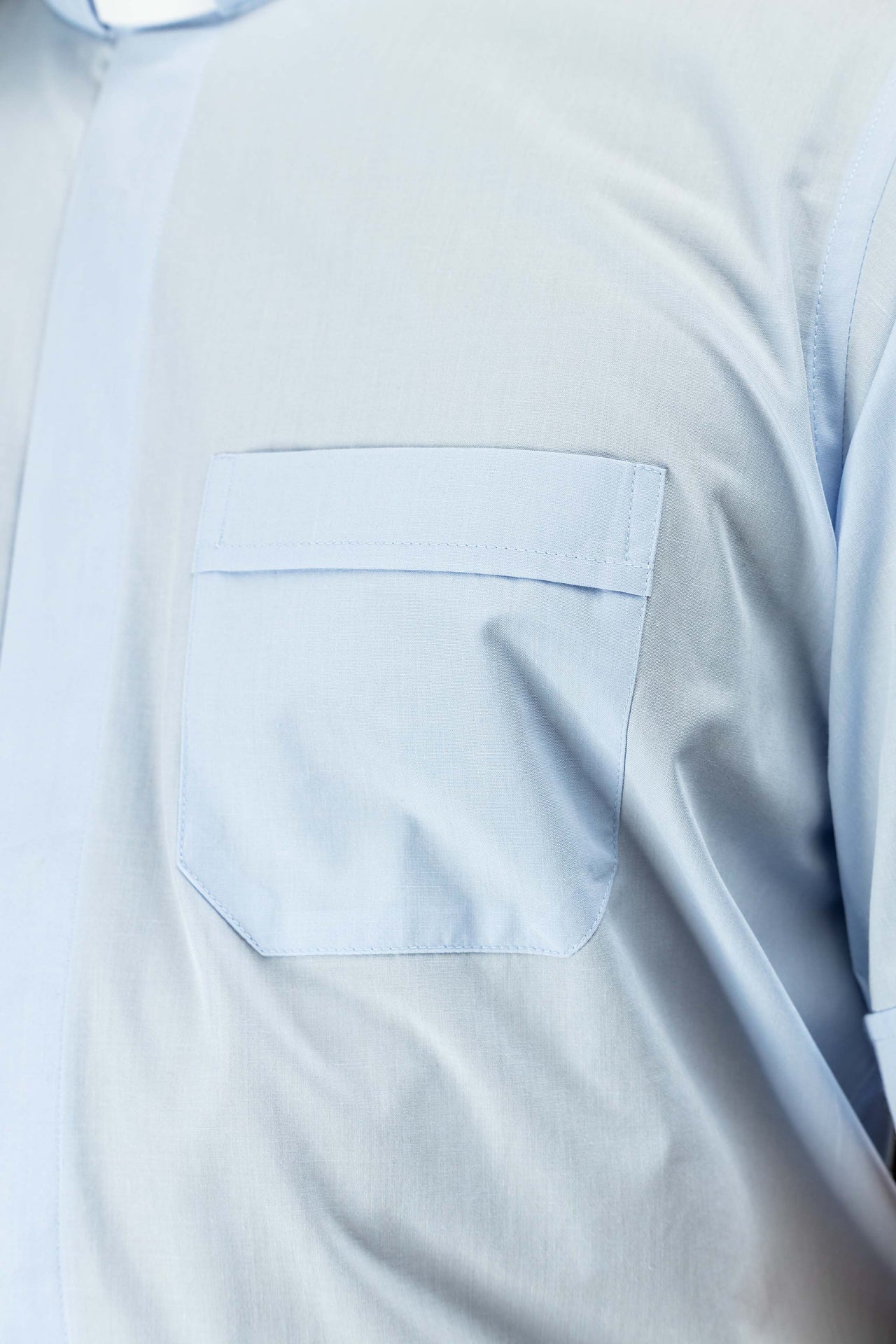 Blue short-sleeved clerical shirt with clerical collar