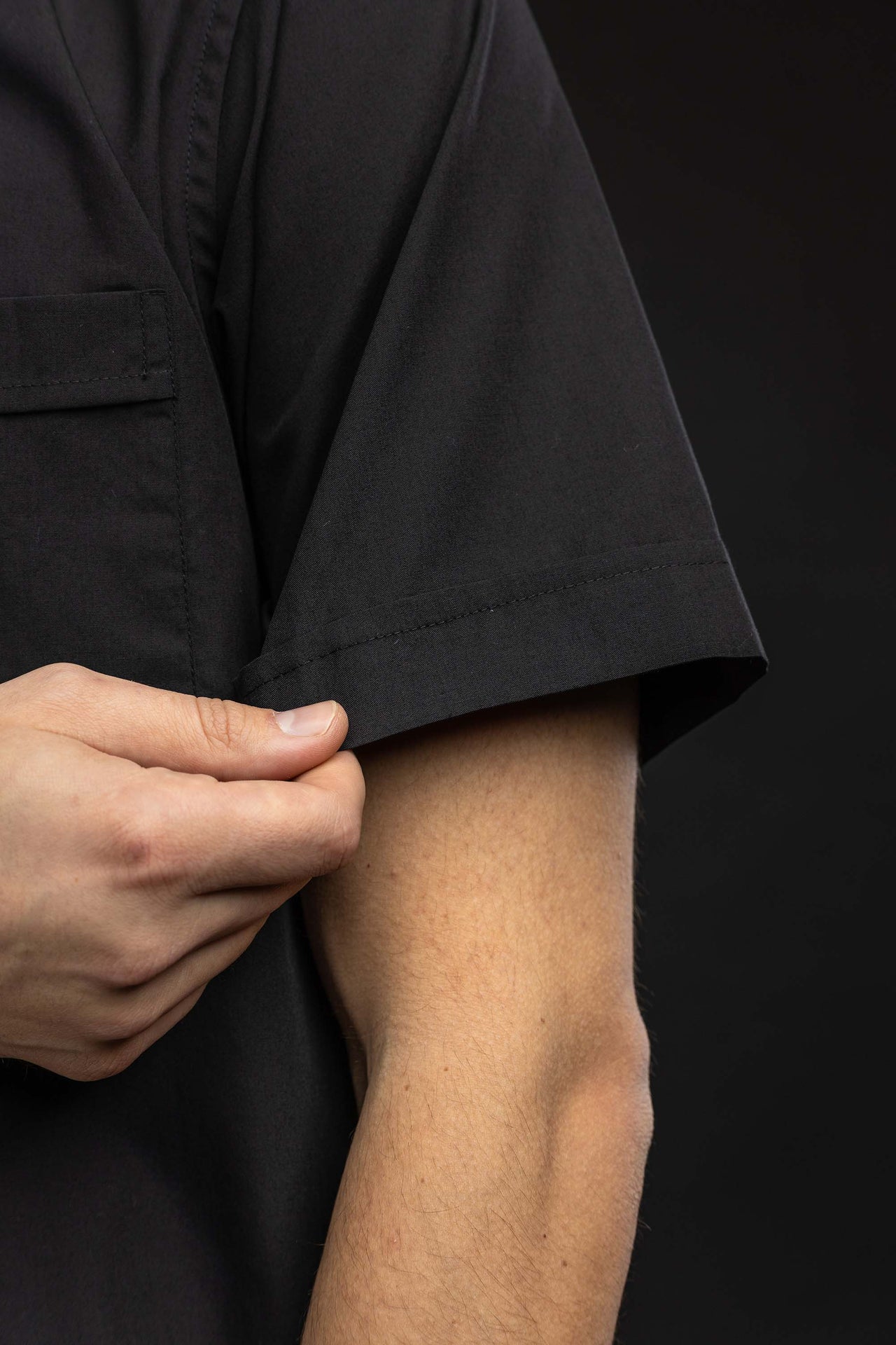 Black short-sleeved Roman clerical shirt with clerical collar