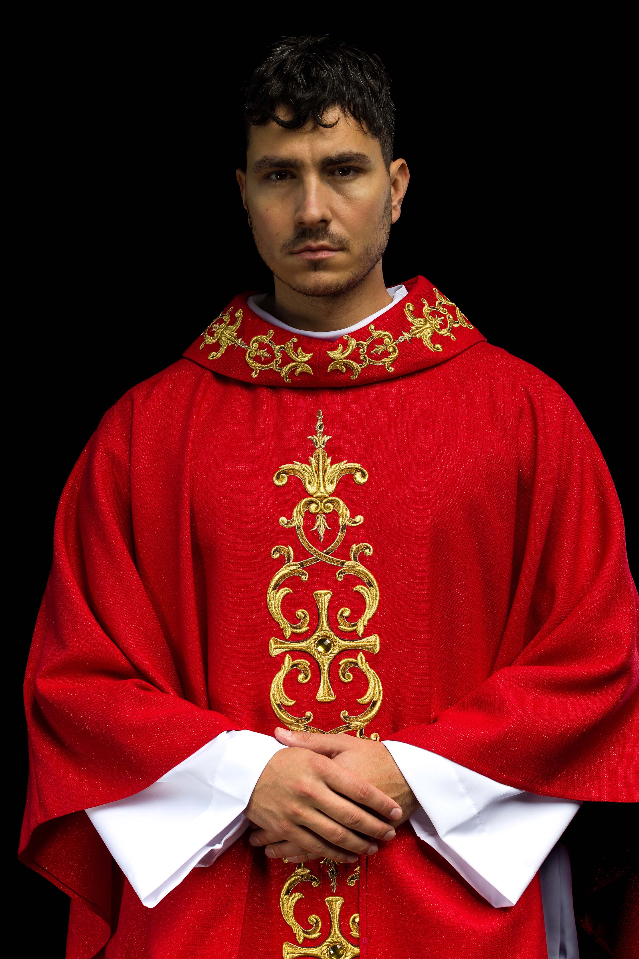 Red chasuble richly embroidered with gemstones