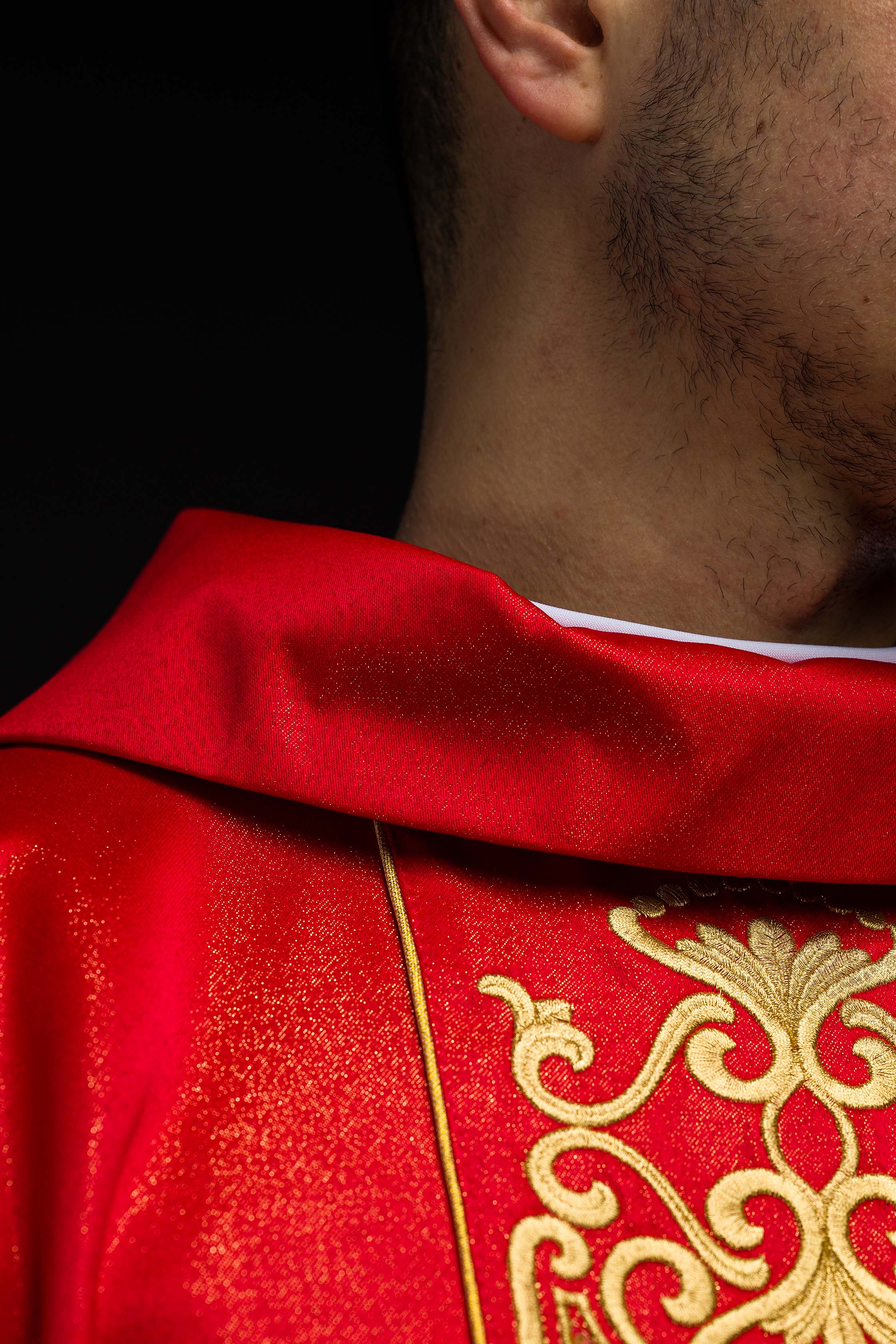 Red chasuble on shiny fabric