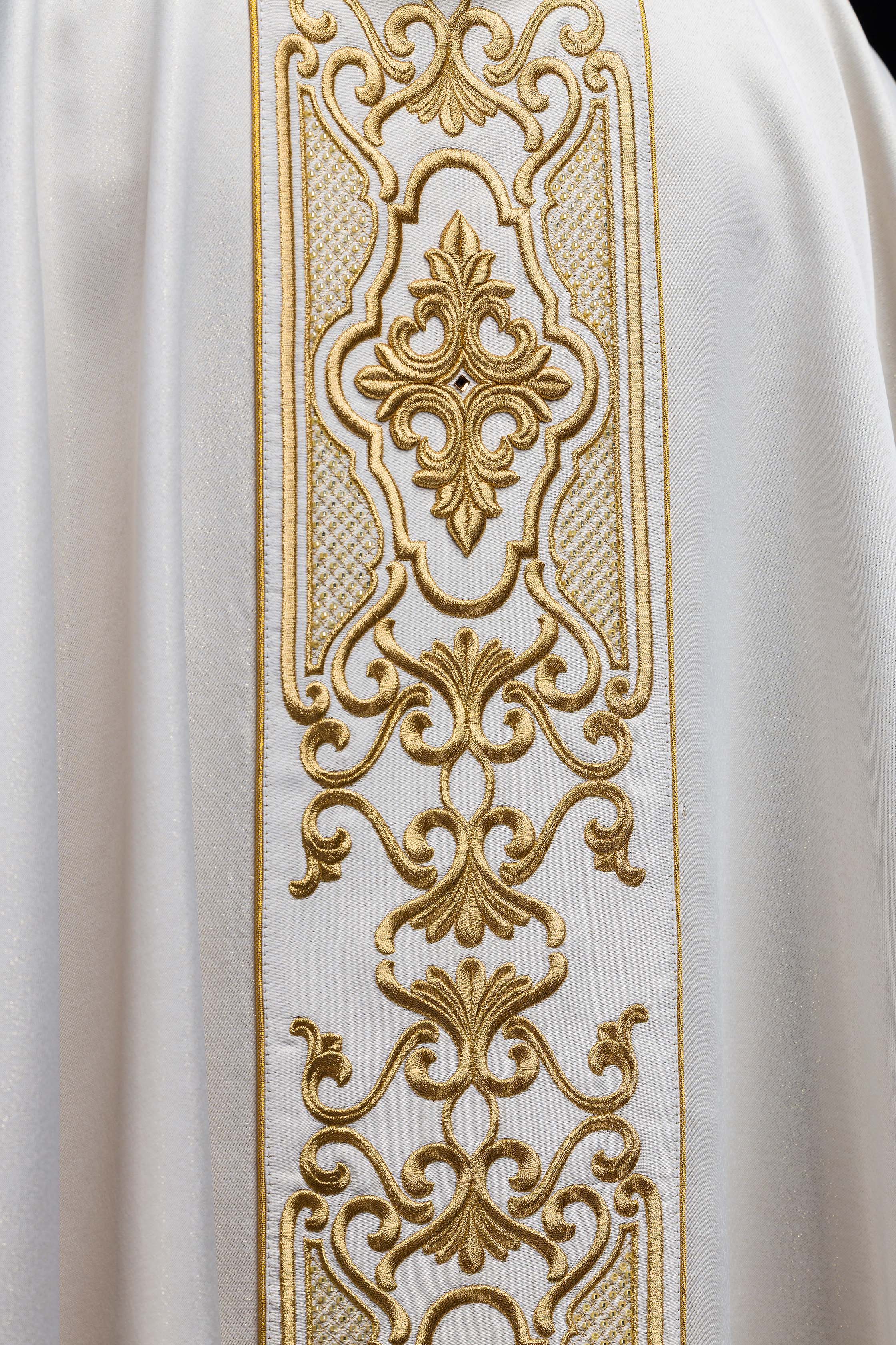 Chasuble made of shiny fabric with rich gold embroidery at the waist