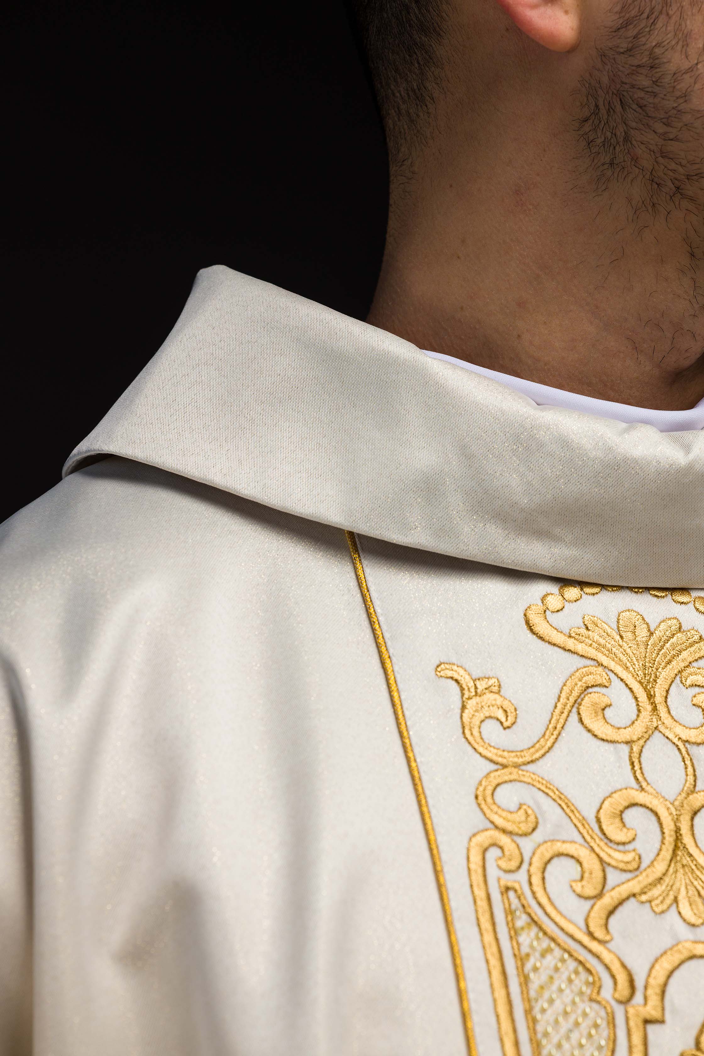 Chasuble made of shiny fabric with rich gold embroidery at the waist