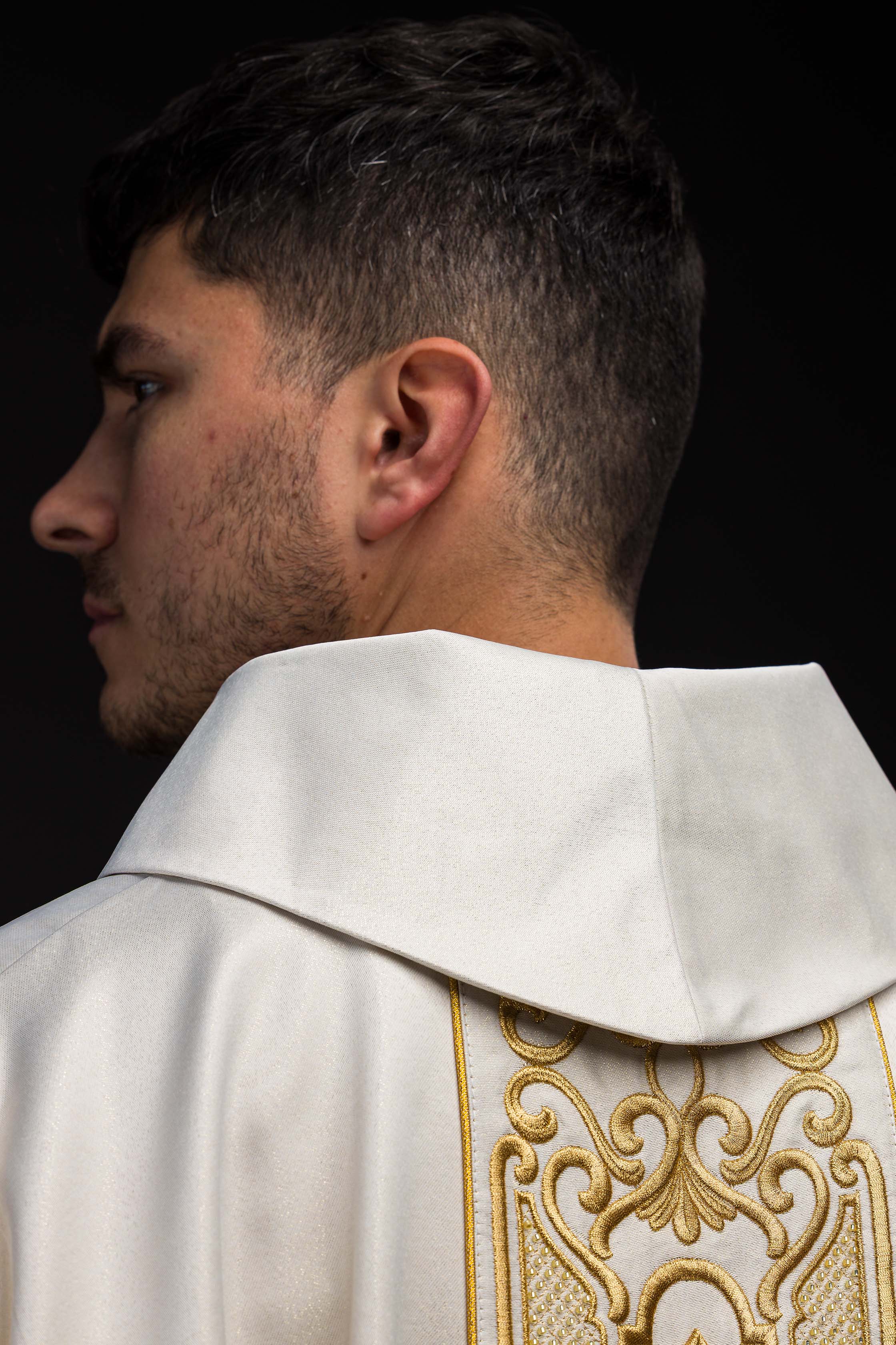 Chasuble made of shiny fabric with rich gold embroidery at the waist