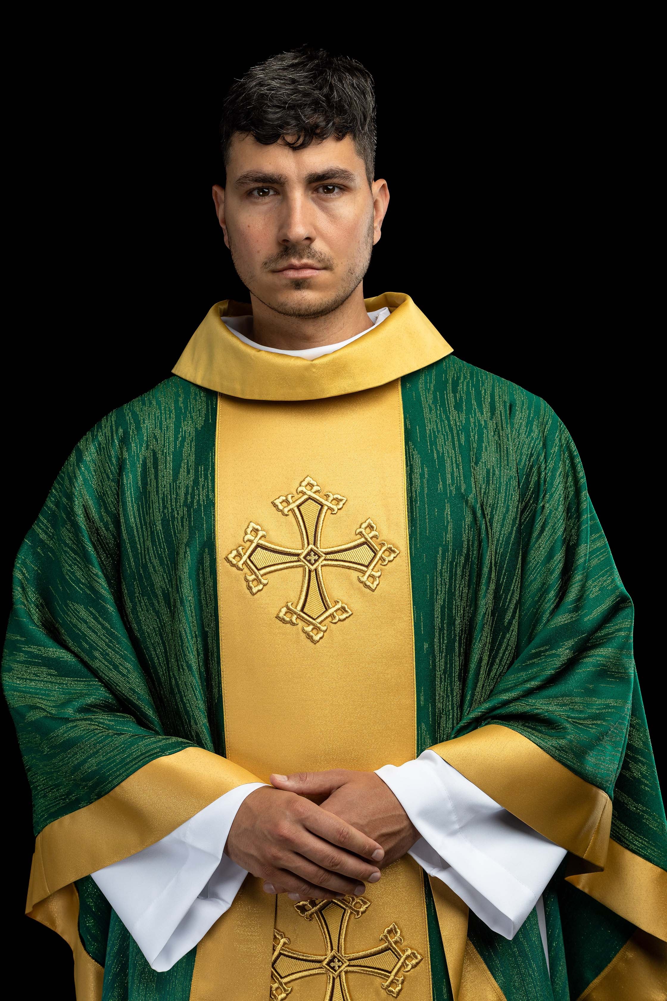 Green chasuble with an embroidered cross motif featuring a panel on decorative fabric