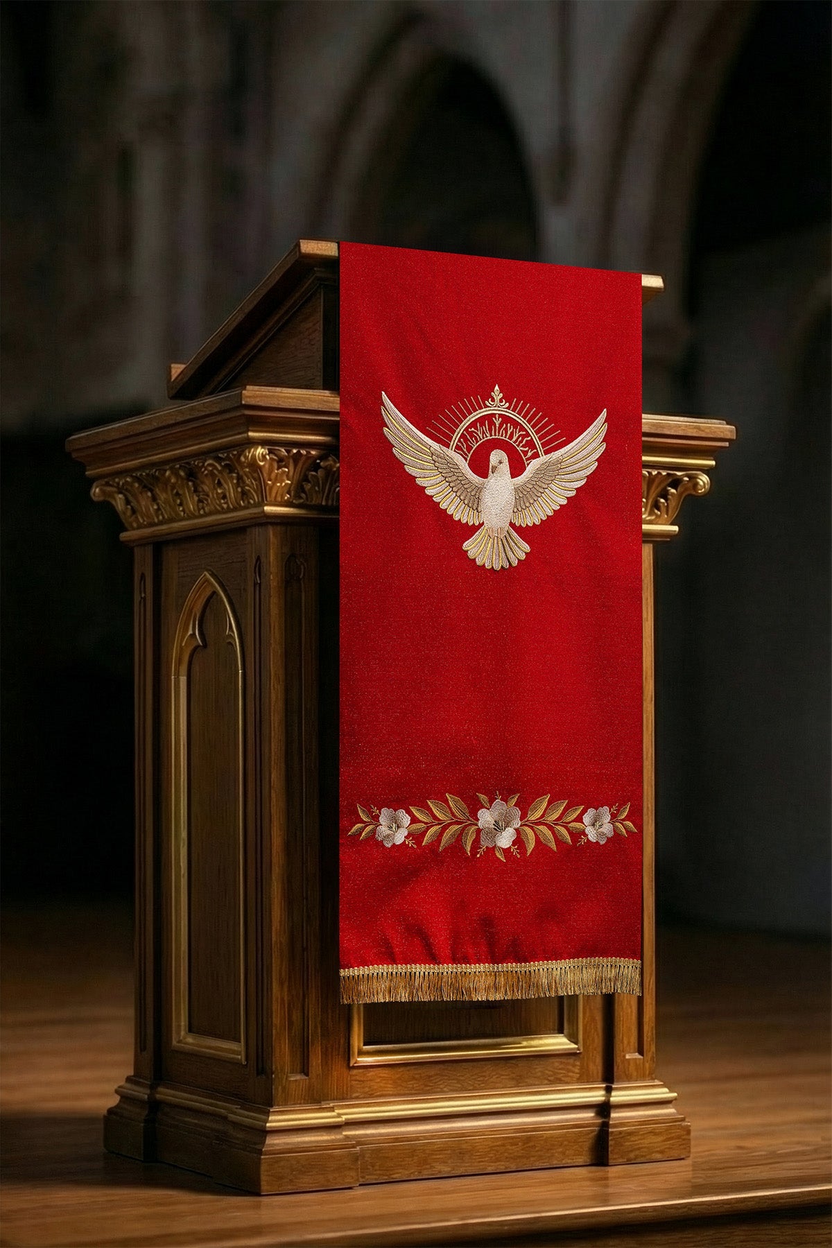 Red embroidered lectern cloth with the symbol of the dove and flames