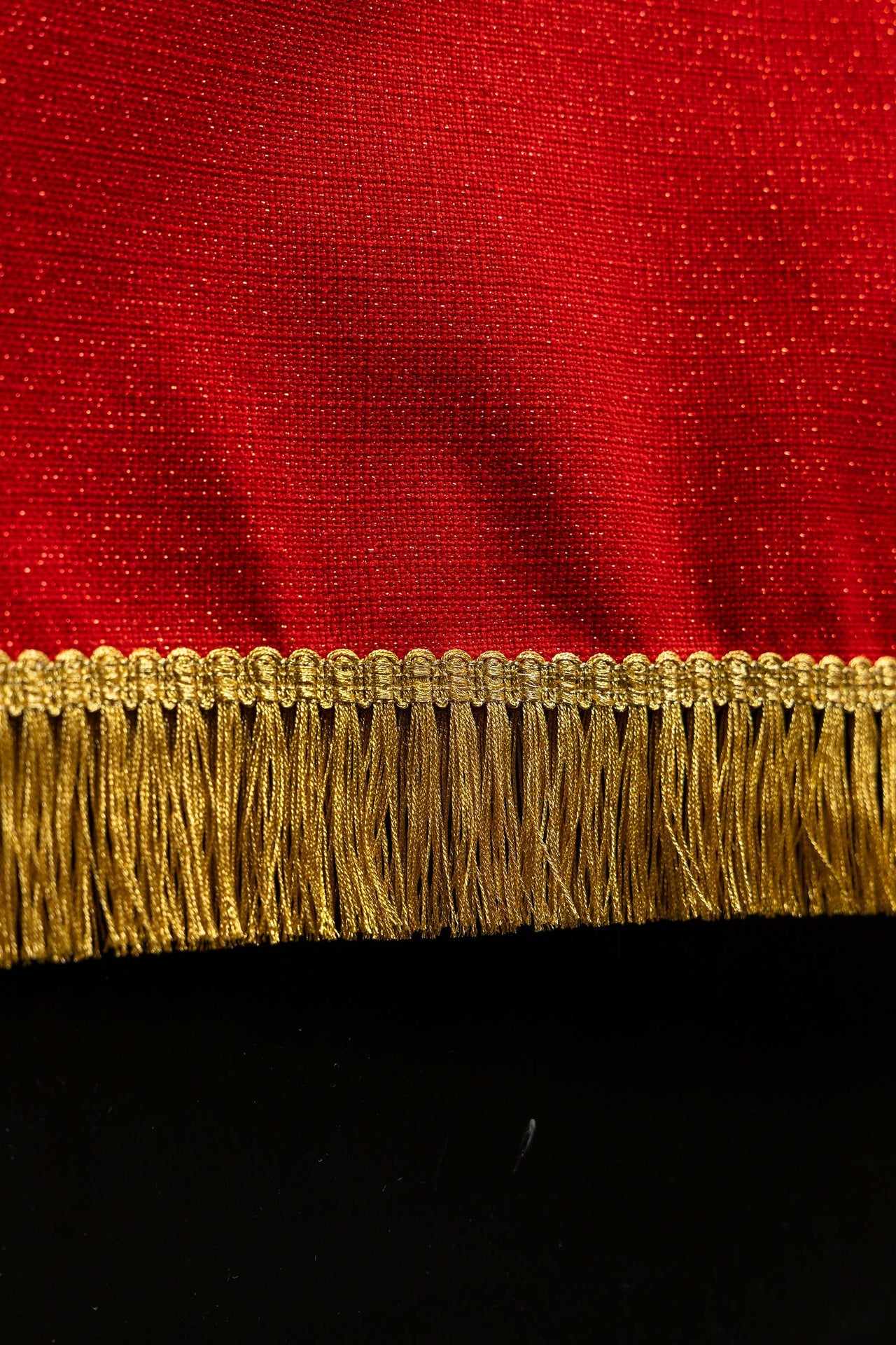 Red embroidered lectern cloth with the symbol of the dove and flames