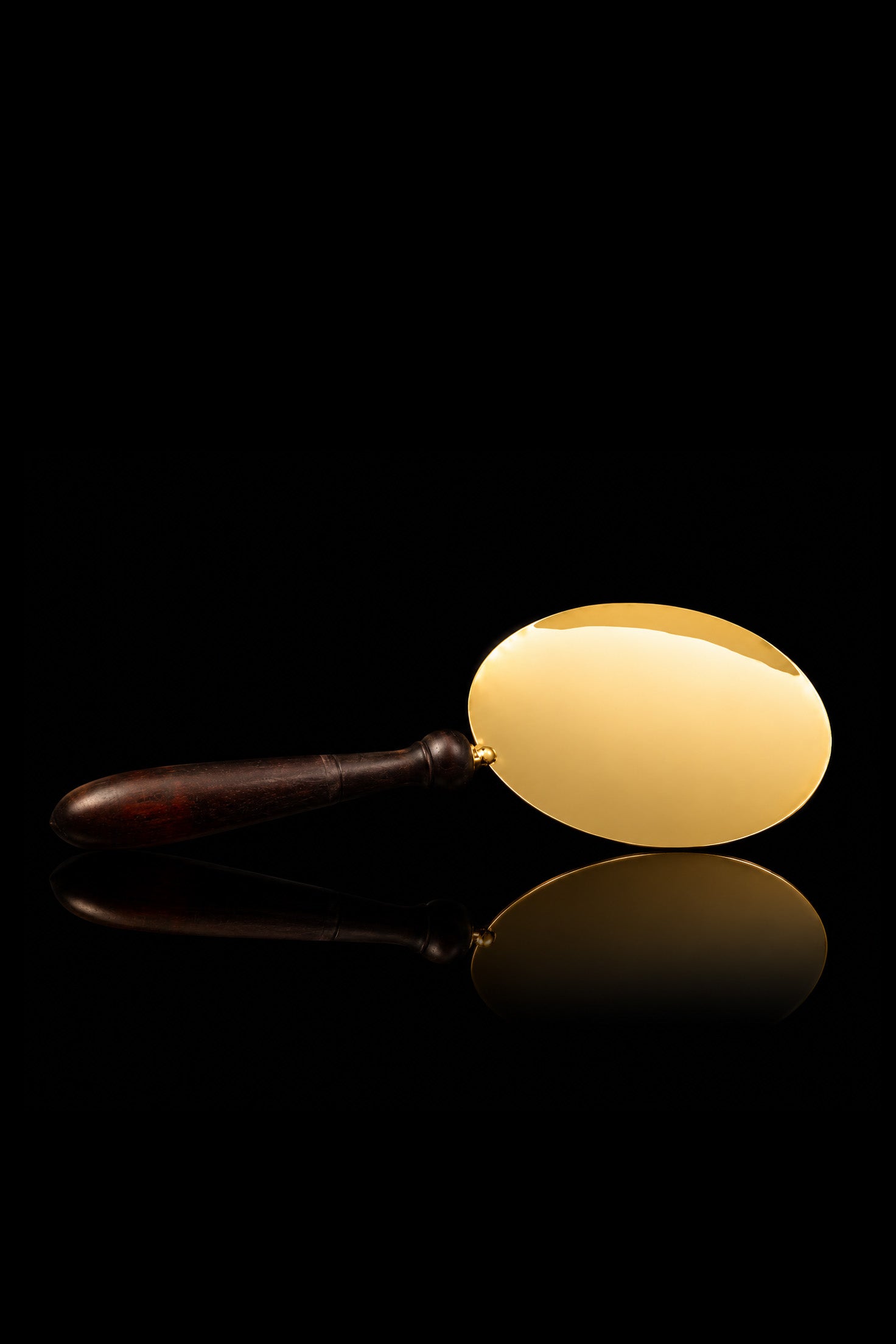 Handcrafted communion paten with a wooden handle
