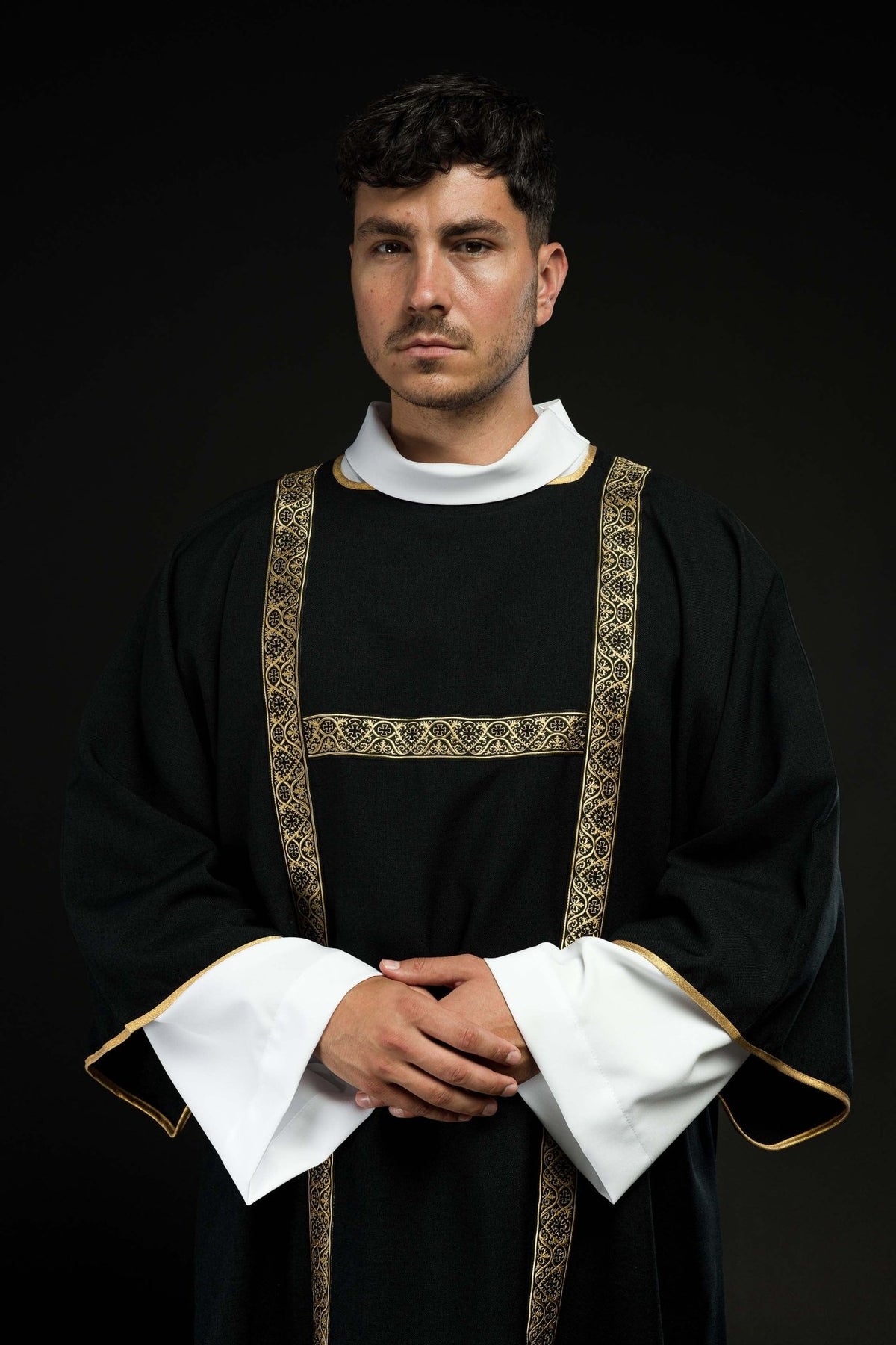 Black dalmatic decorated with gold jacquard ribbons