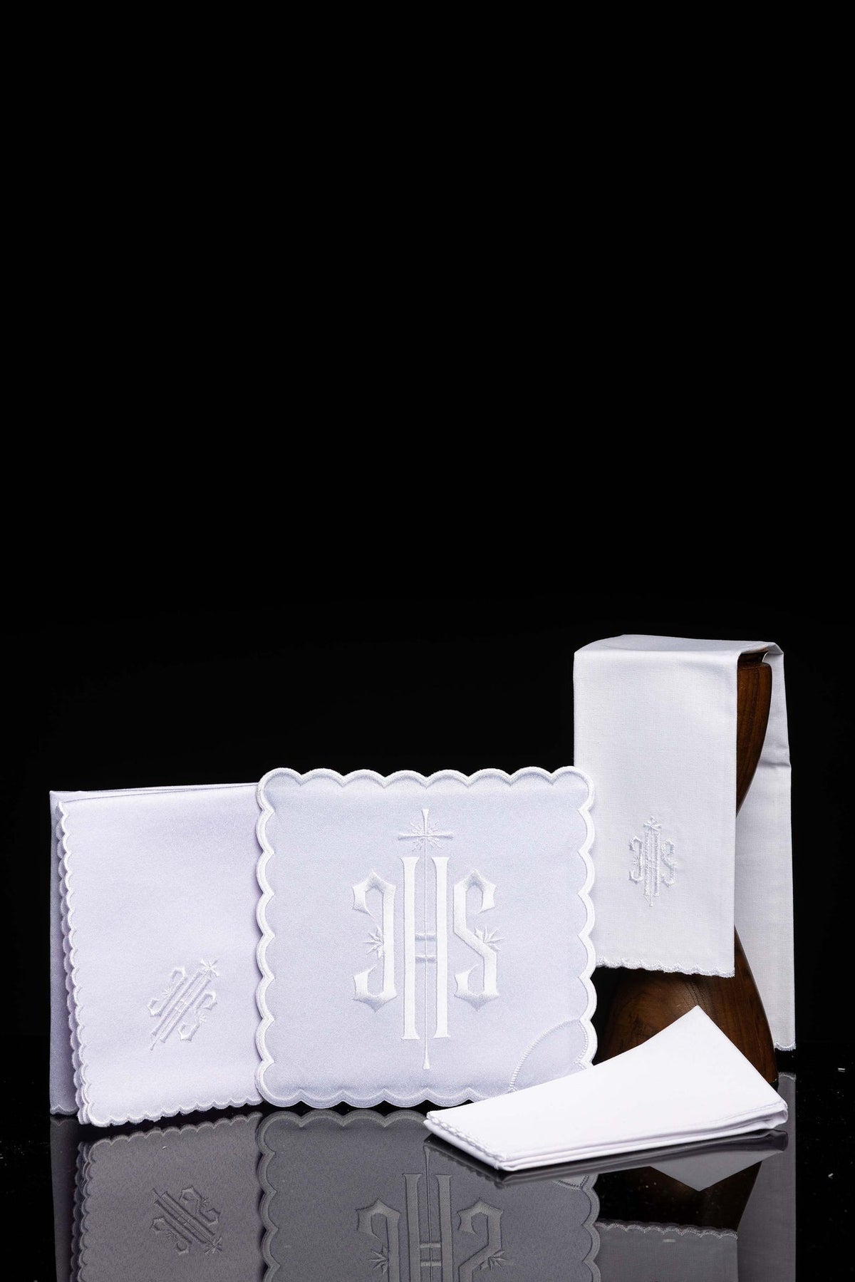 Front view of a Chalice Linen Set with White Trim and IHS Embroidery, showing white linens and scalloped edges