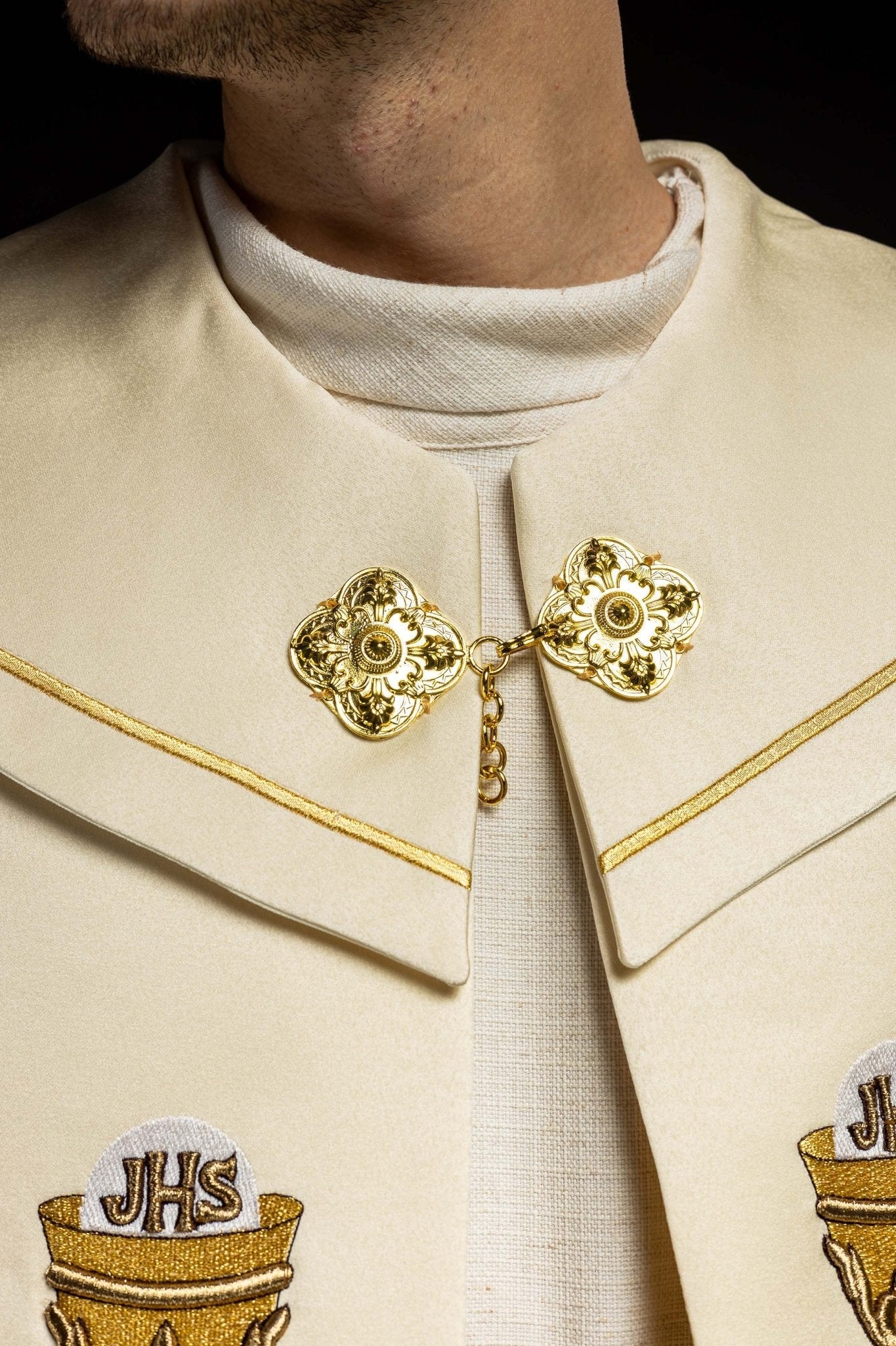 Clerical cope with embroidered gold IHS motif KKP/006/05 ECRU SAT.POMPON 145cm - HAFTINAUSA.COM