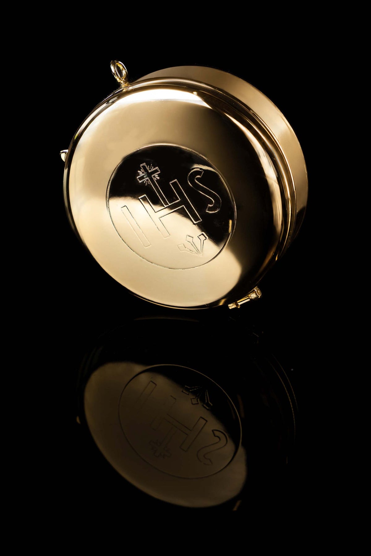 Bottom view of the gold-plated ciborium with IHS emblem and hinge fittings