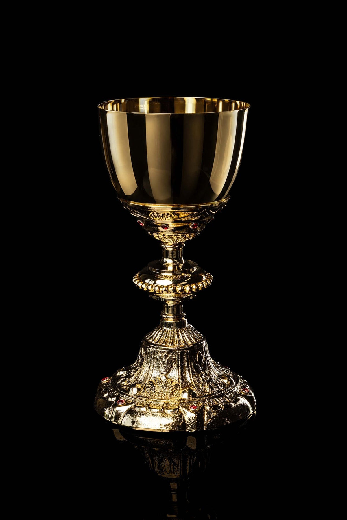 Front view of a Gold-Plated Chalice Decorated with Imitation Rubies, with ornate relief and red stones