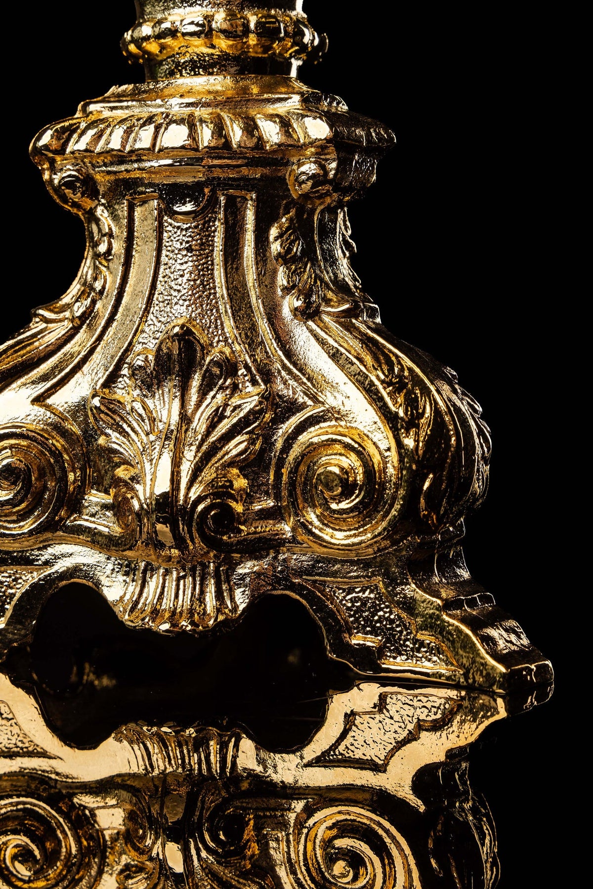 Base detail of a monstrance with gold-plated Baroque scrollwork