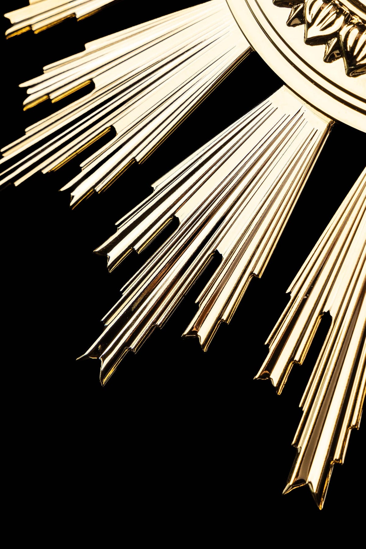 Detail view of the monstrance showing pointed gold-plated rays