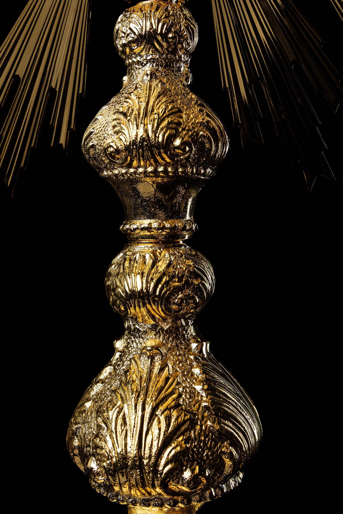Close-up of the monstrance showing the ornate gold-plated rim and radiant rays
