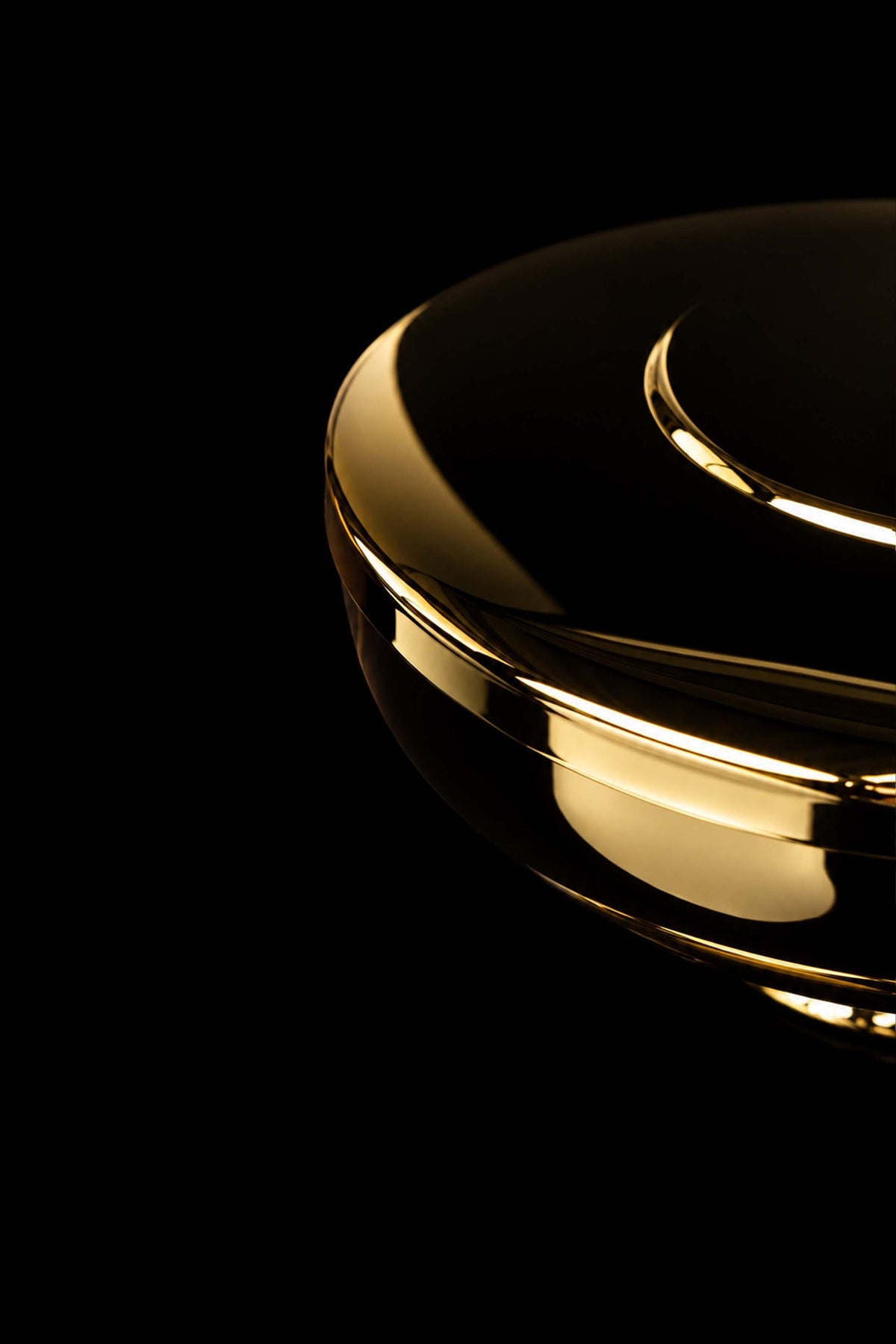 Side close-up of the gold-plated brass ciborium showing the polished rim and lid edge