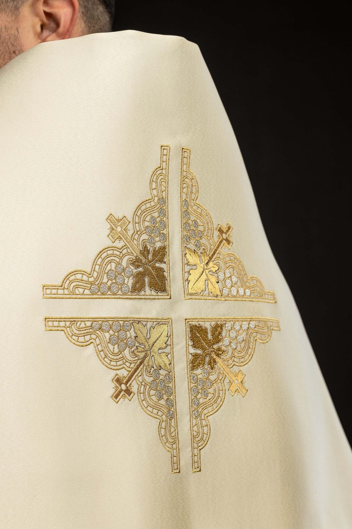 Back detail of the humeral veil showing the embroidered cross with grapes and leaves
