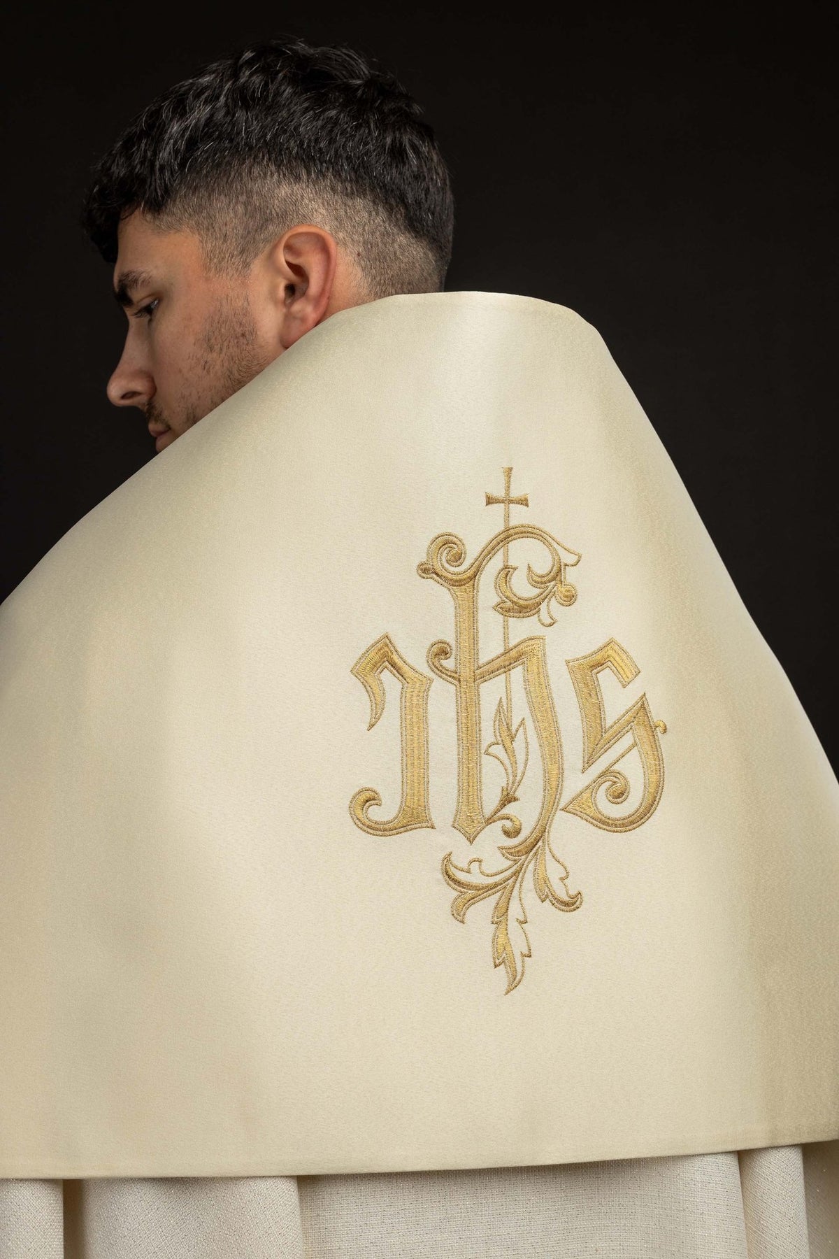 Back close-up of an Ecru Humeral Veil with Embroidered IHS Motif showing gold IHS embroidery