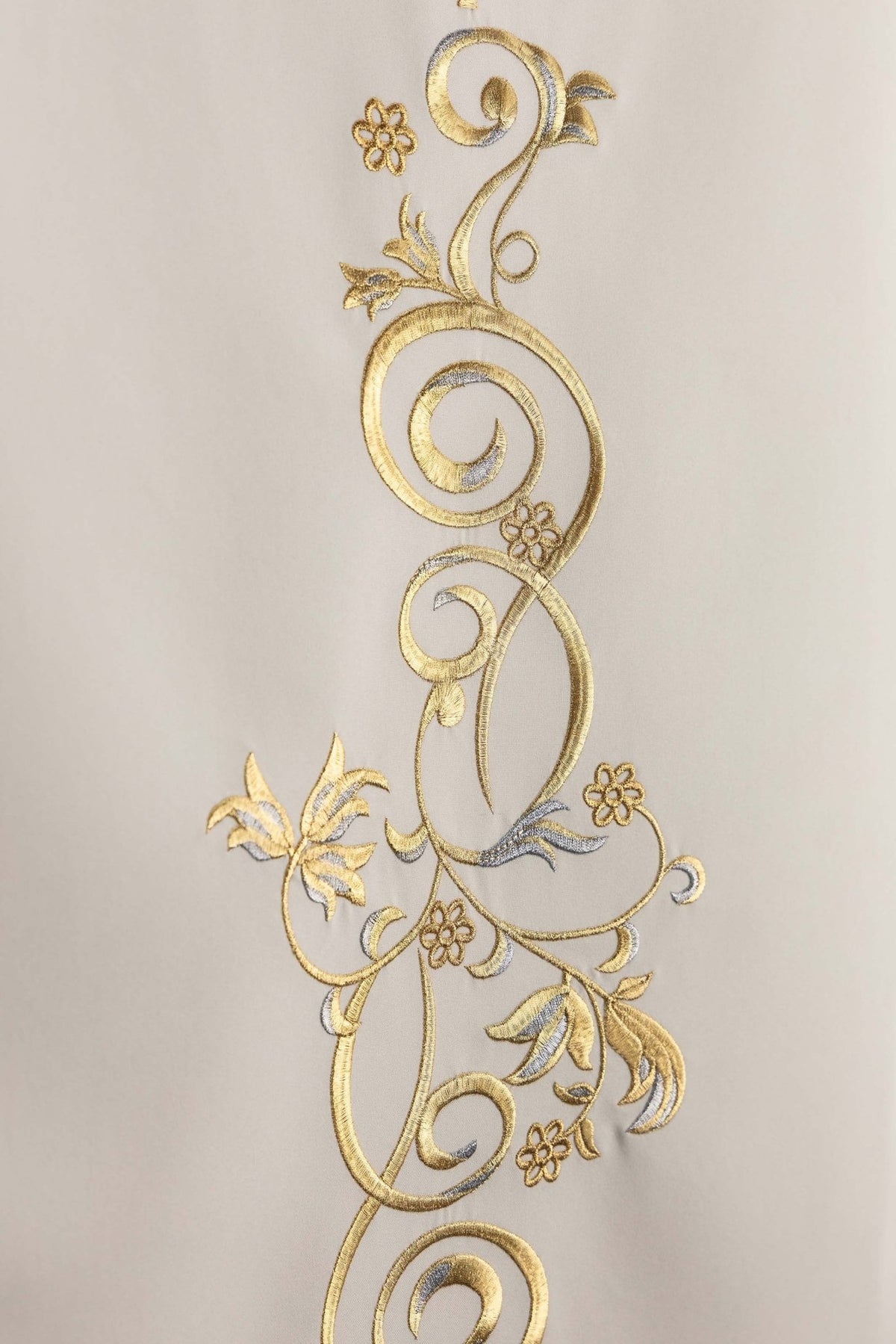 Close-up of the lectern cloth showing gold botanical scroll embroidery with flowers and leaves