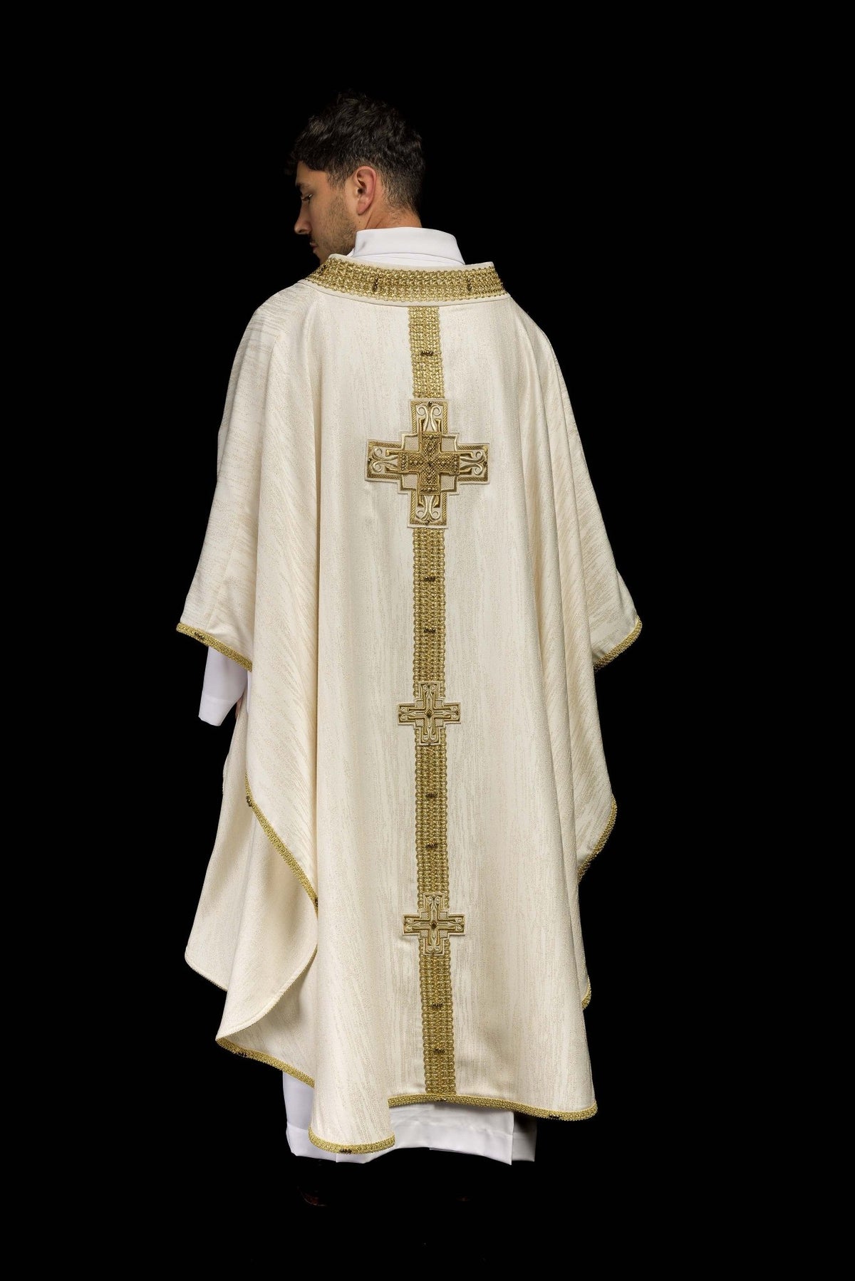 Full back view of an ecru handmade chasuble with natural stones and gold cross motifs