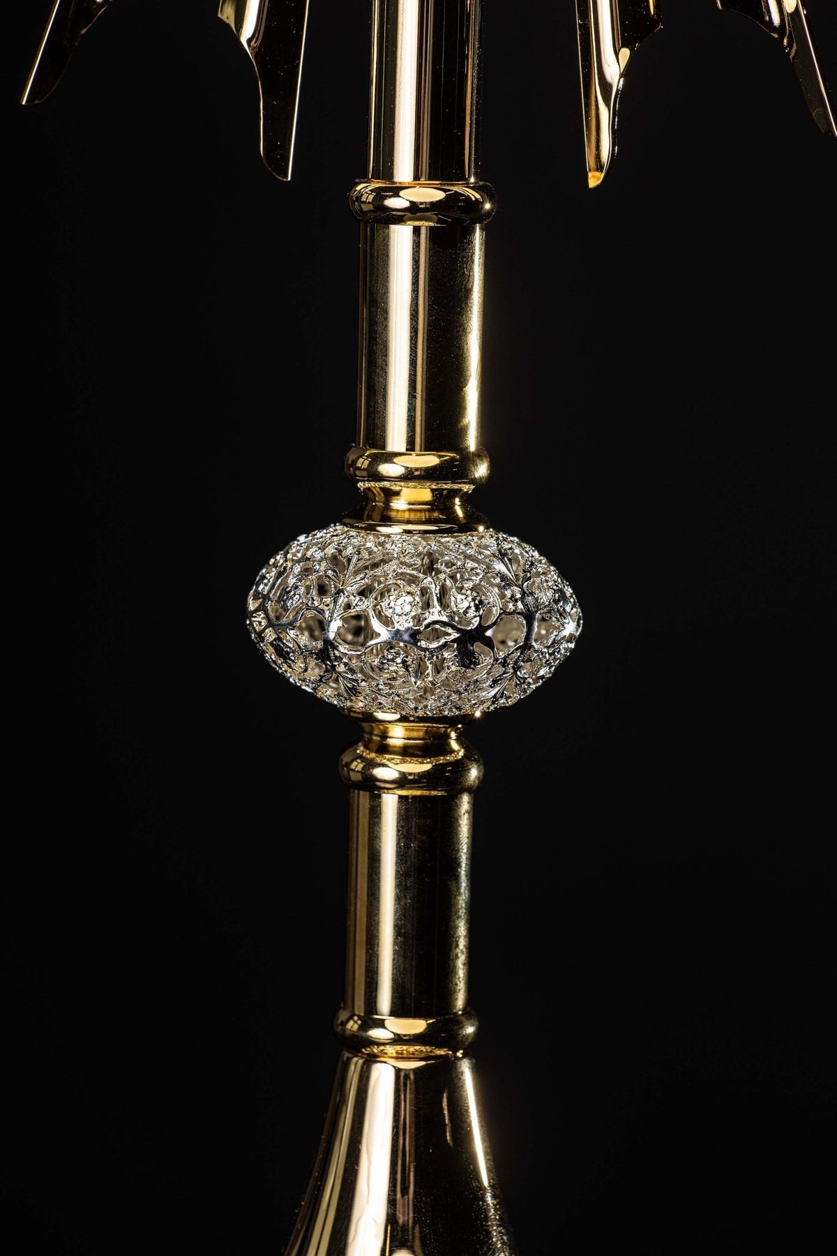 Close-up of the monstrance showing gilded stem and ornate silver-tone knop