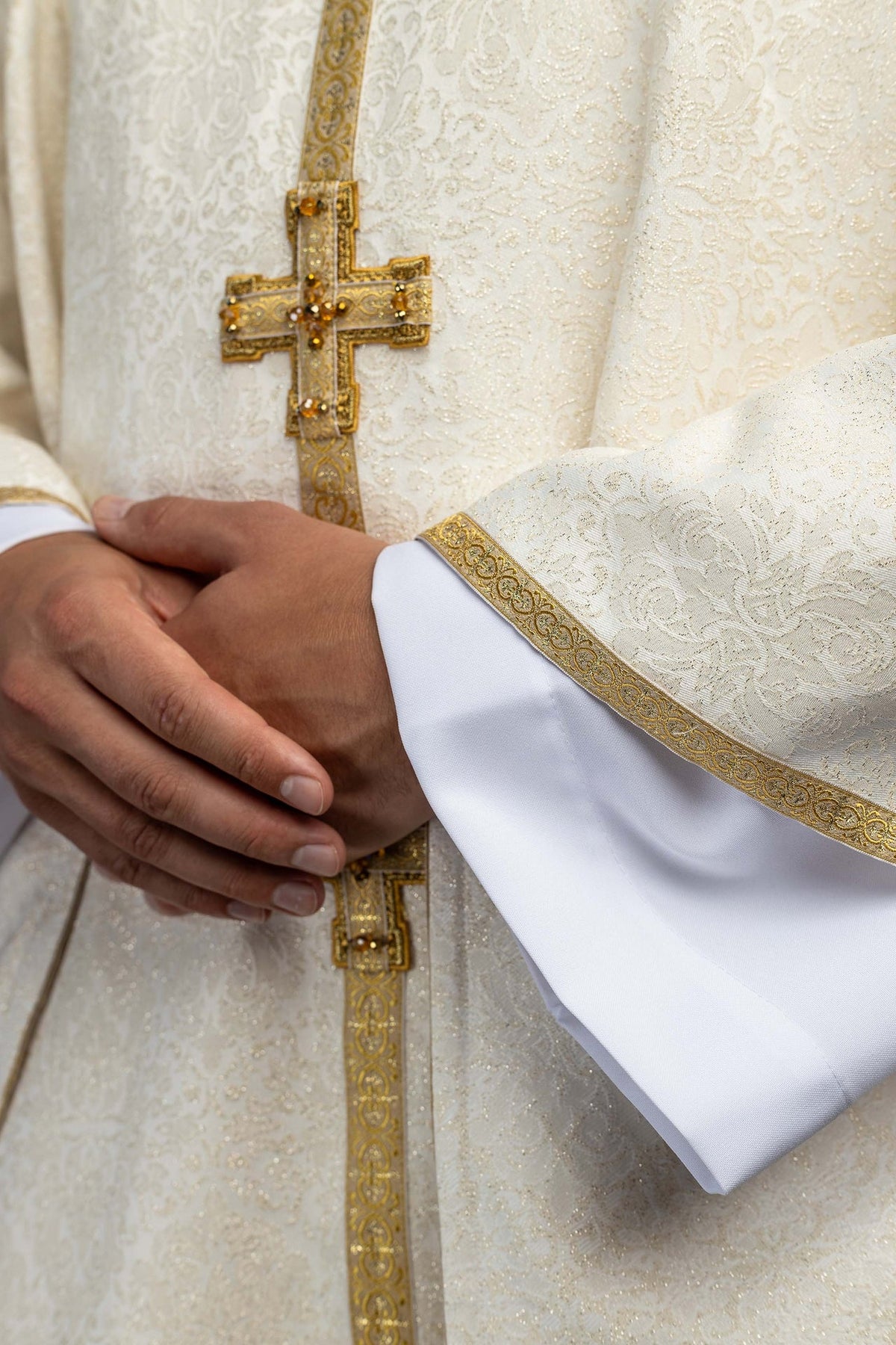 Close-up of the chasuble front cross and gold embroidered center band