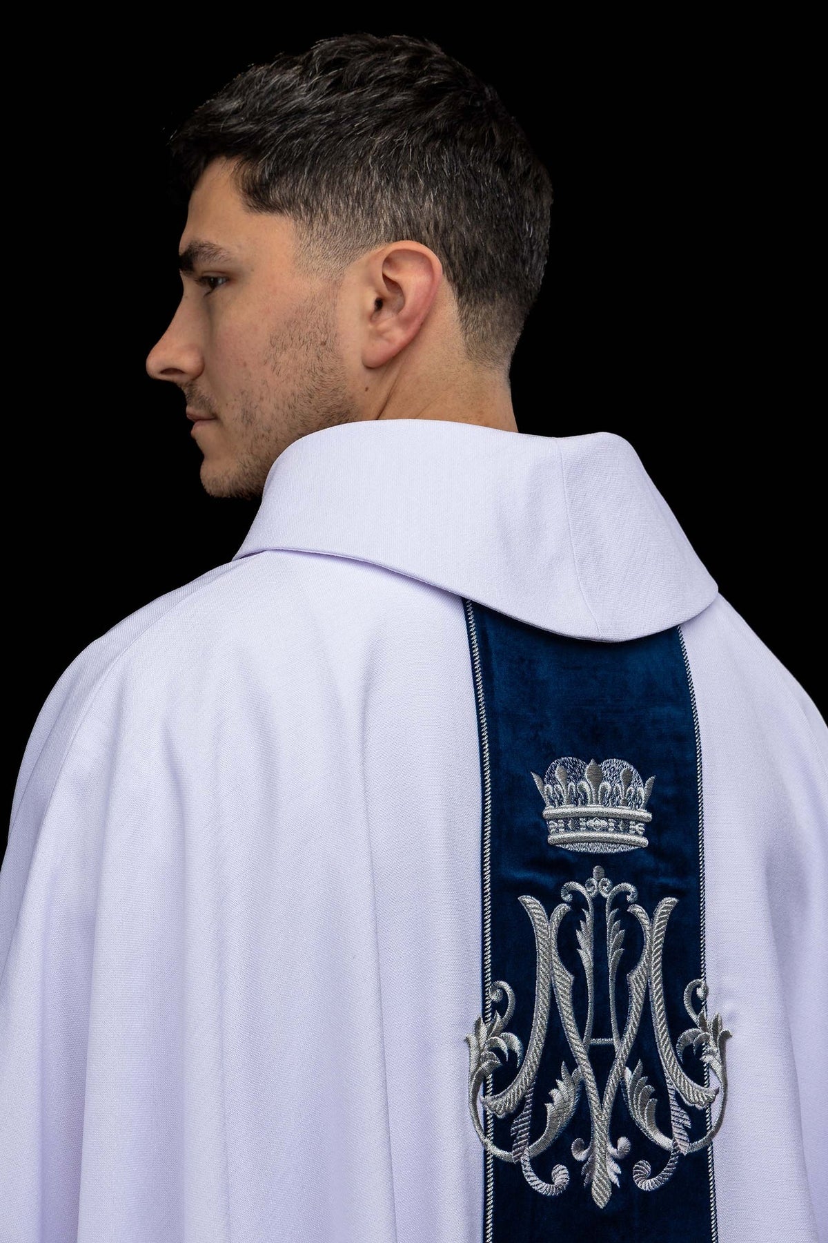 Back view of the ecru Marian chasuble with blue velvet orphrey and silver embroidery