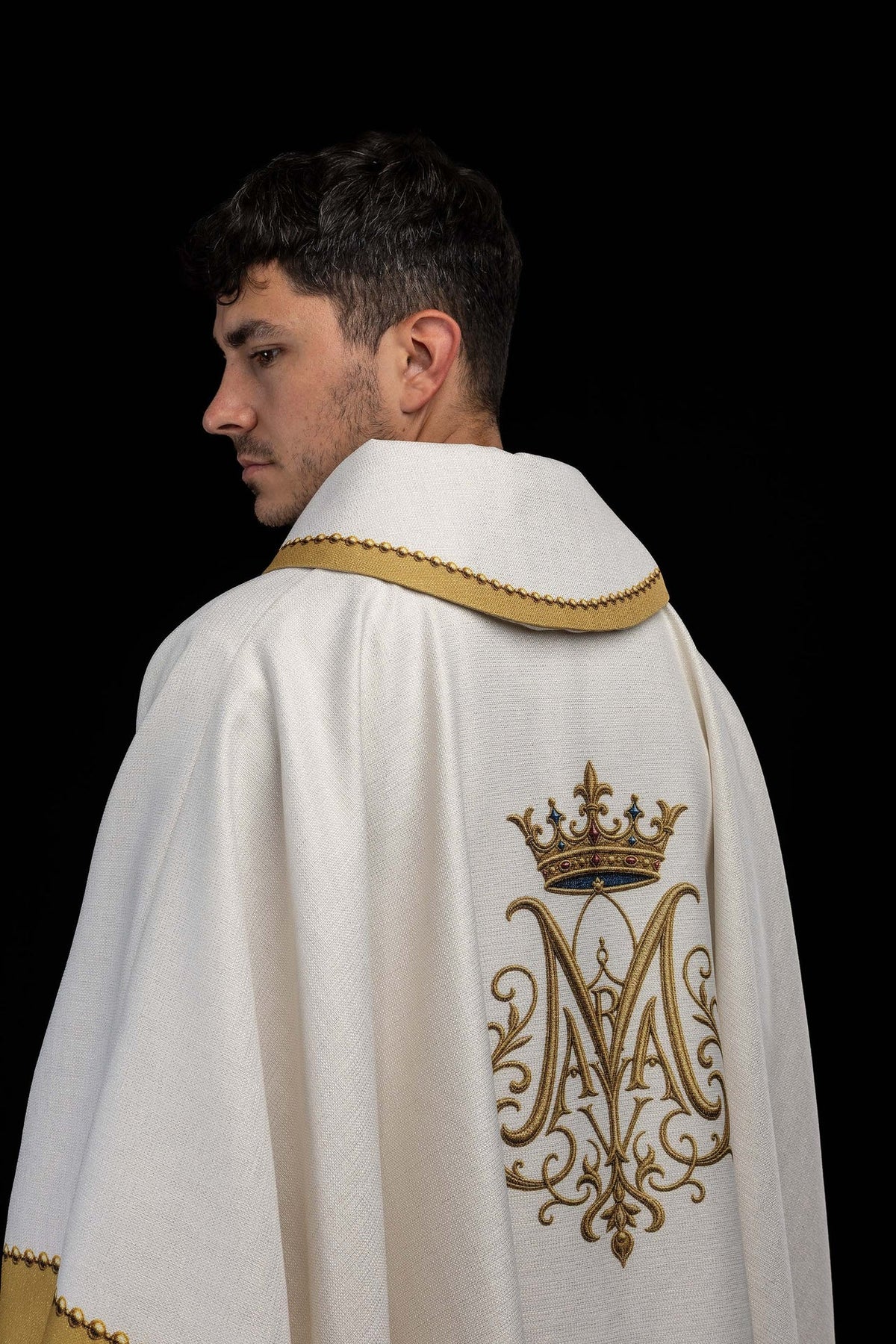 Back view of the chasuble with a crowned gold-and-blue Marian monogram