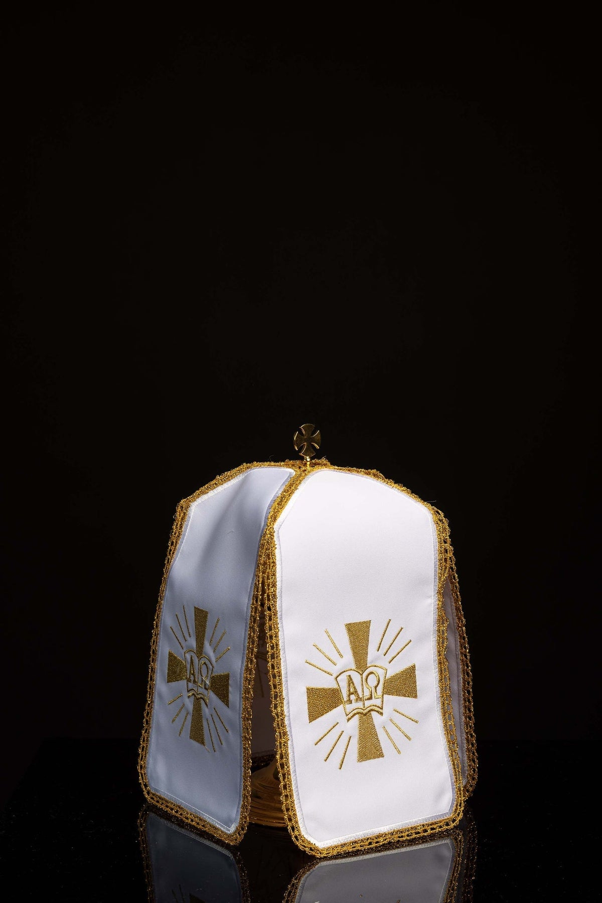 Front view of Ciborium Veil Embroidered with Gold Alpha and Omega Symbols in white with gold trim