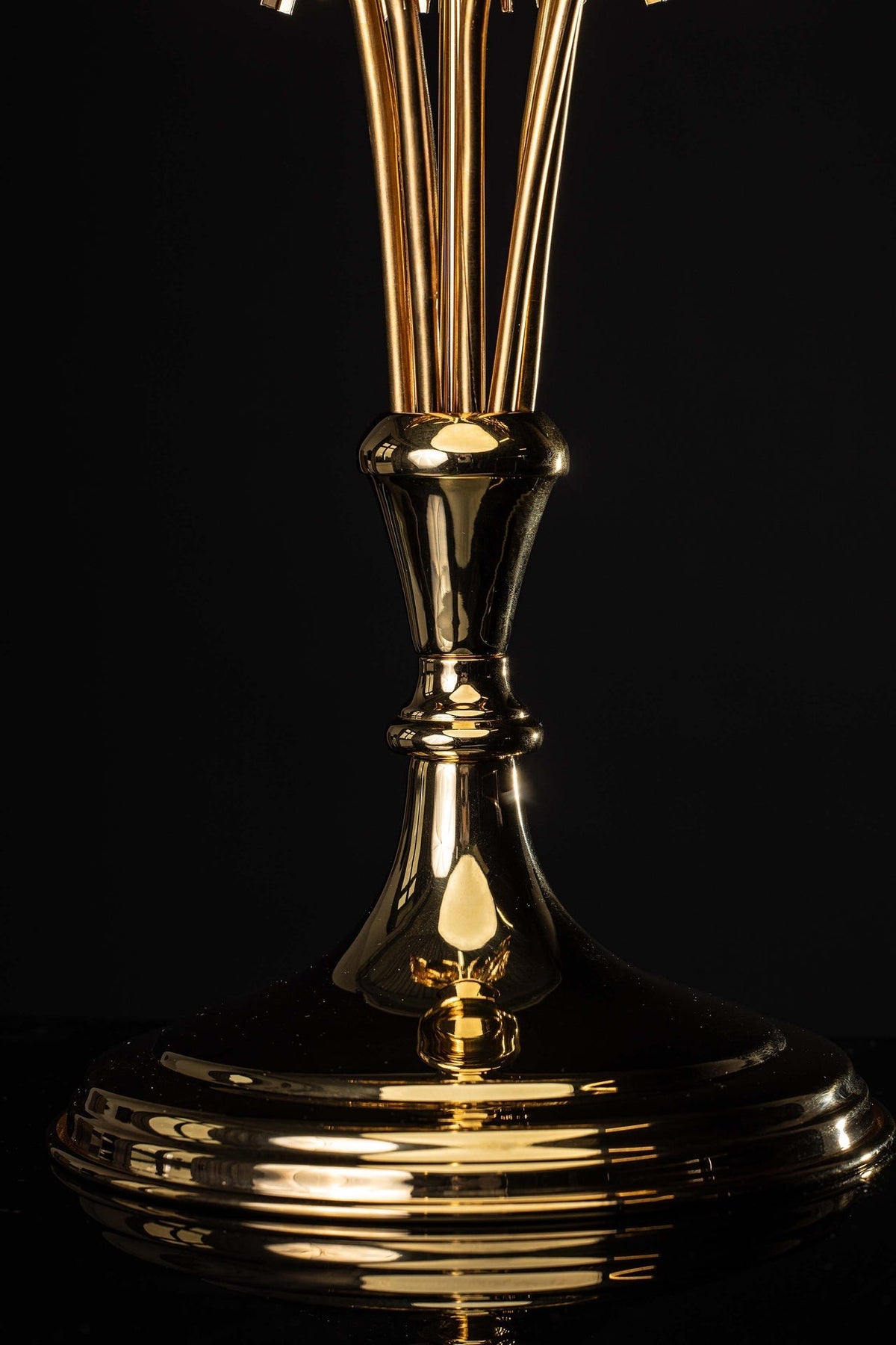 Base detail of gilded brass monstrance with polished stem, knop and round foot