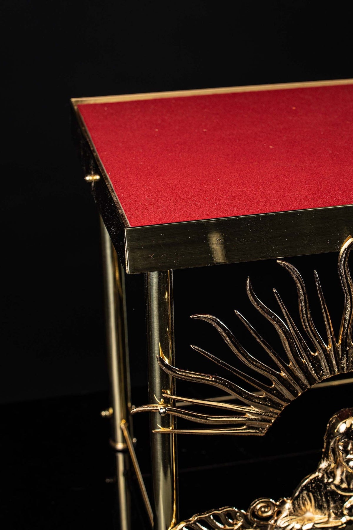 Top detail of the monstrance throne showing red velvet and gilded edging