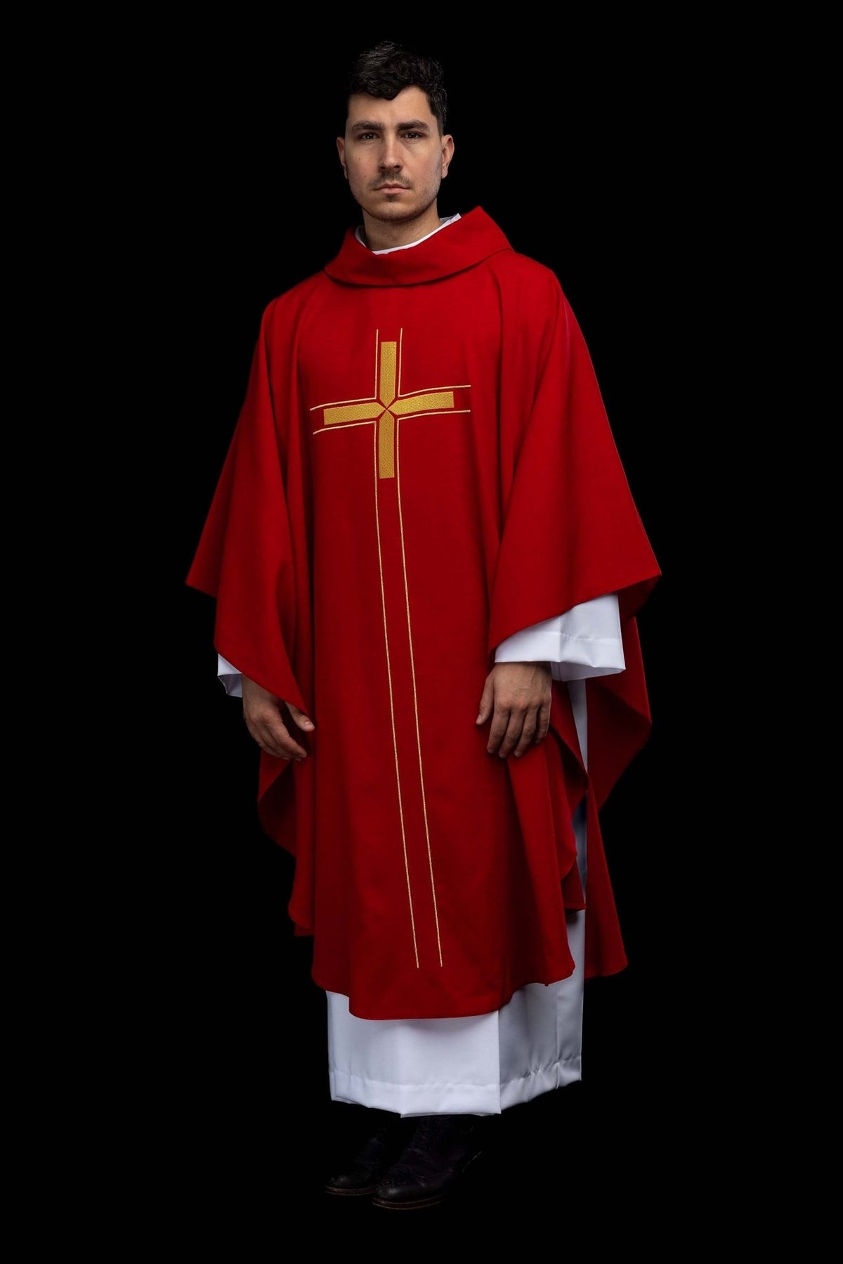 Full front view of the red chasuble with embroidered gold cross