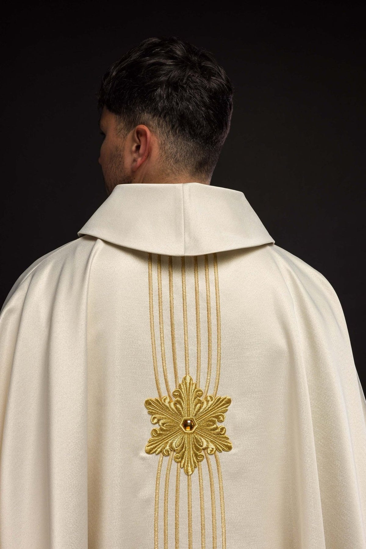 Close-up of the chasuble's gold crown embroidery and stand-up collar