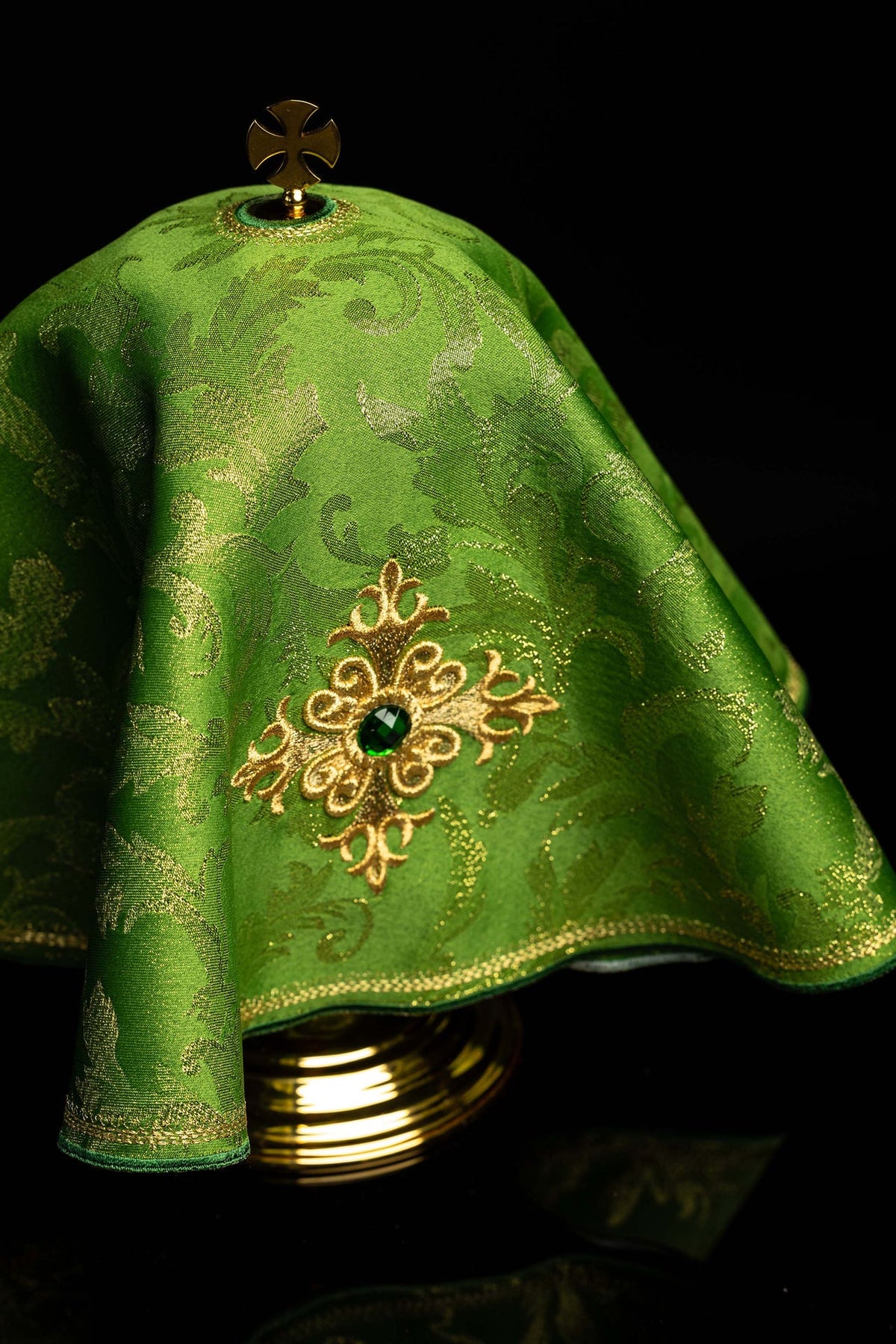 Front detail of the green ciborium veil with embroidered cross and green stone