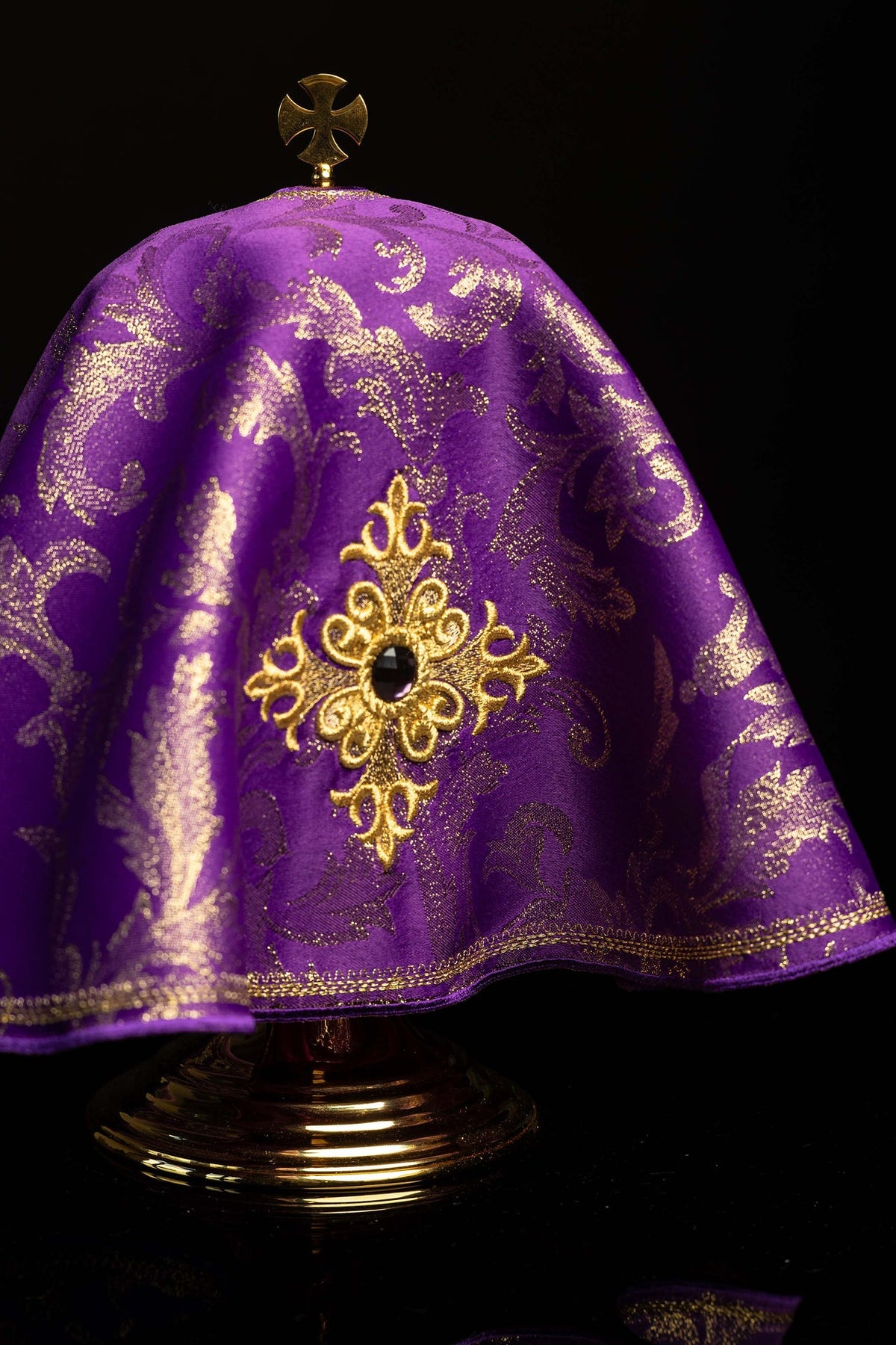 Front detail of the purple ciborium veil with embroidered cross and stone