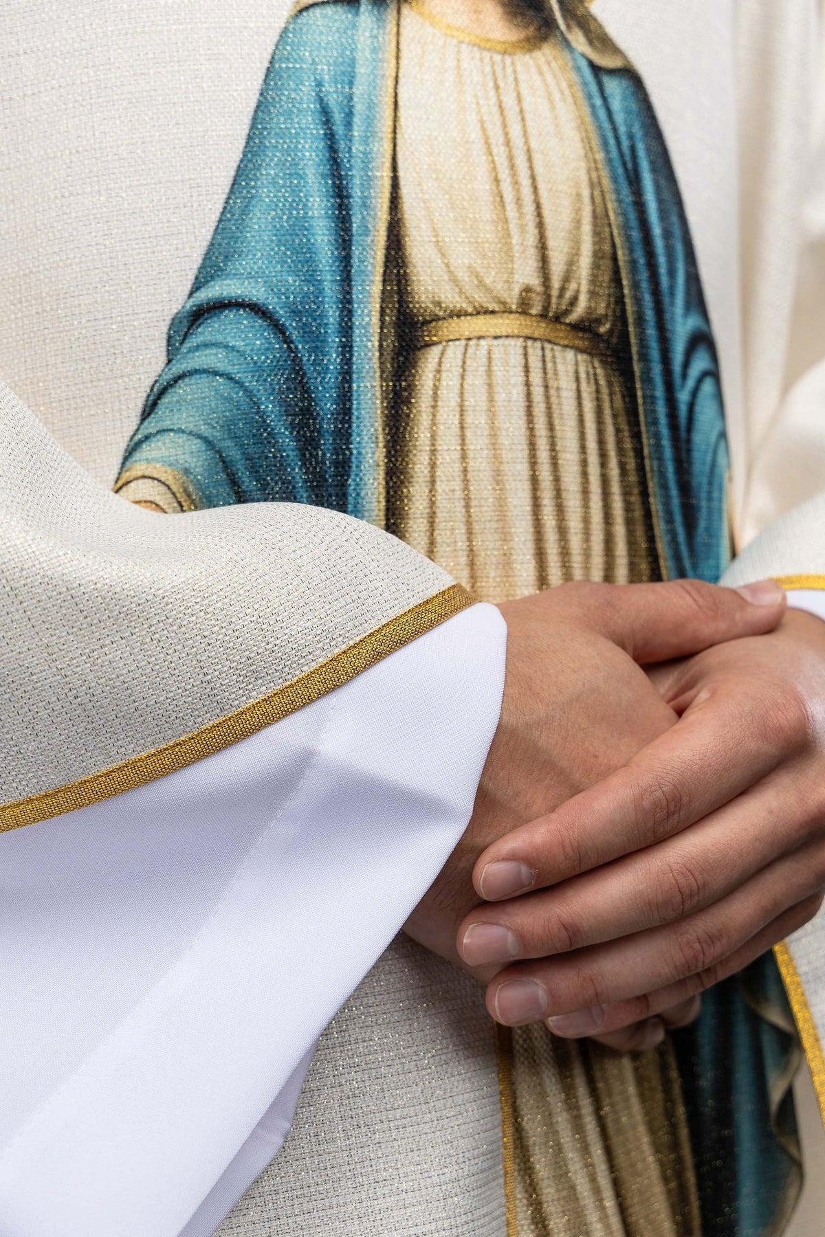 Close-up of the blue and cream Immaculate Conception image on the chasuble