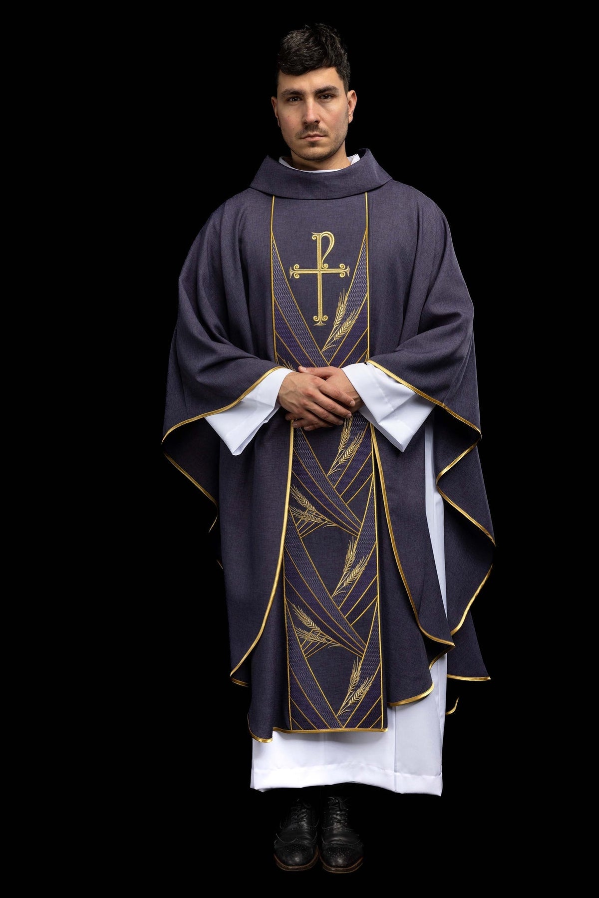 Full front view of the purple chasuble with embroidered Pax band and gold edging