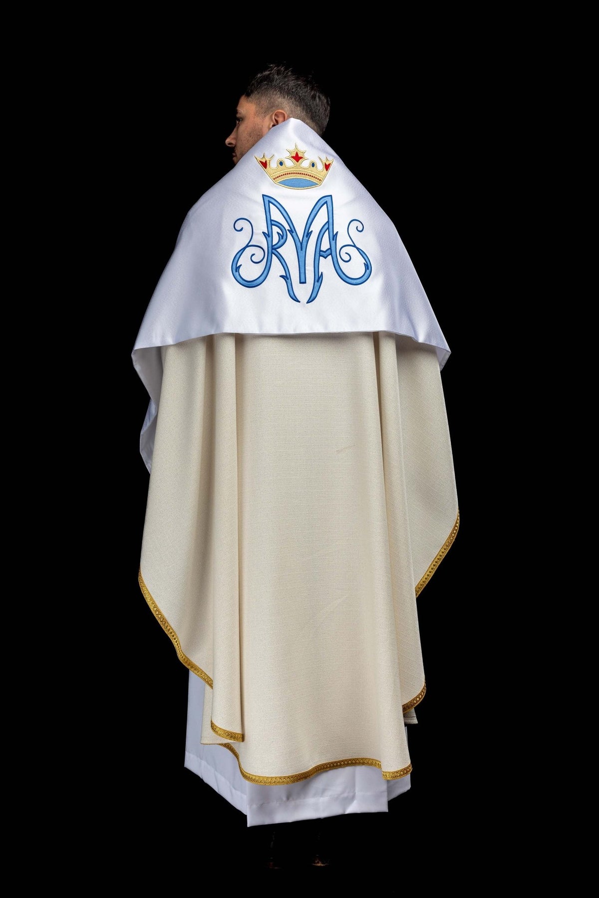 Worn back view of the white humeral veil showing Marian embroidery and gold-trimmed edges