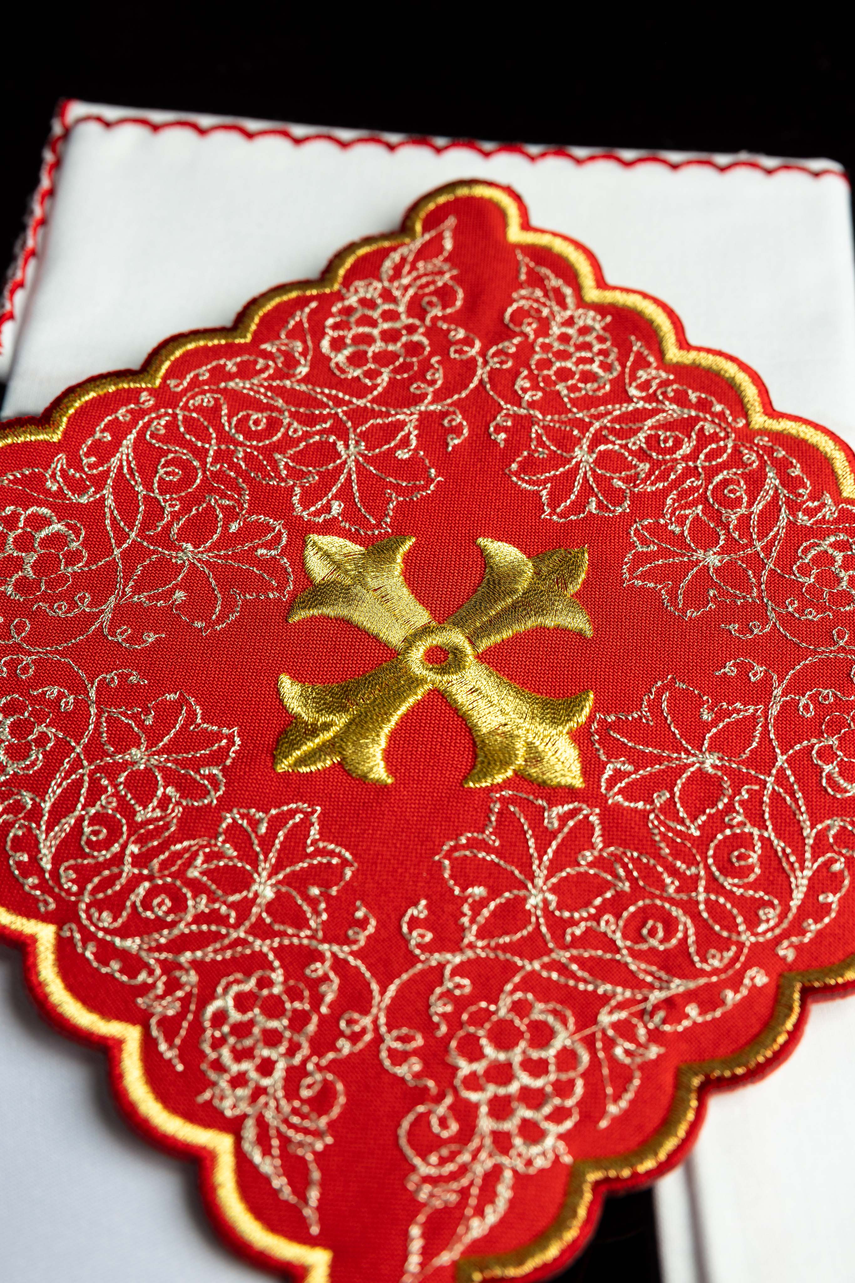Red embroidered chalice linens set with a cross motif